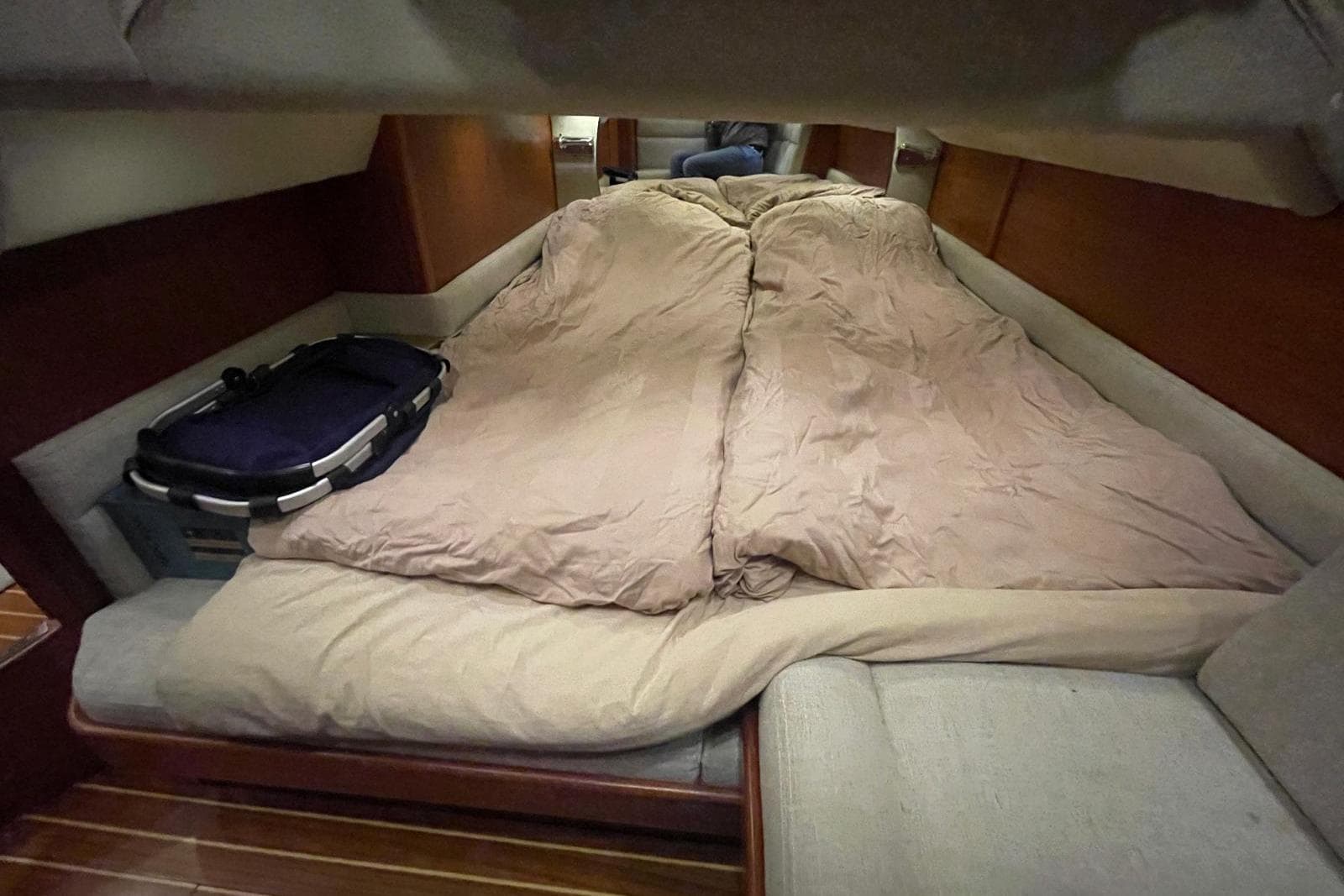 Cozy cabin interior of 2010 Nord West 370 Sports Top with comfortable bedding.