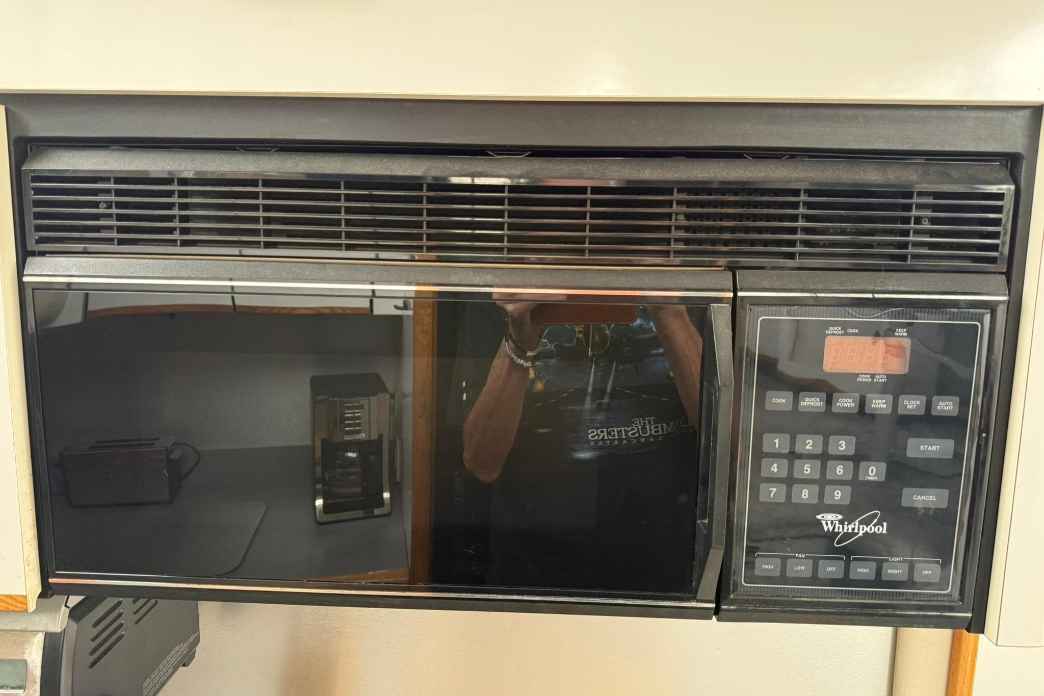 Whirlpool microwave in a 1991 Bayliner 4387 Motoryacht kitchen setup.