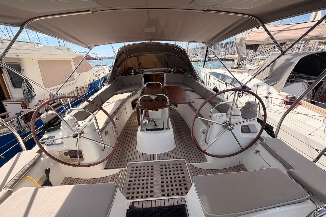 2008 Jeanneau Sun Odyssey 45 DS yacht cockpit with dual steering wheels and seating area.