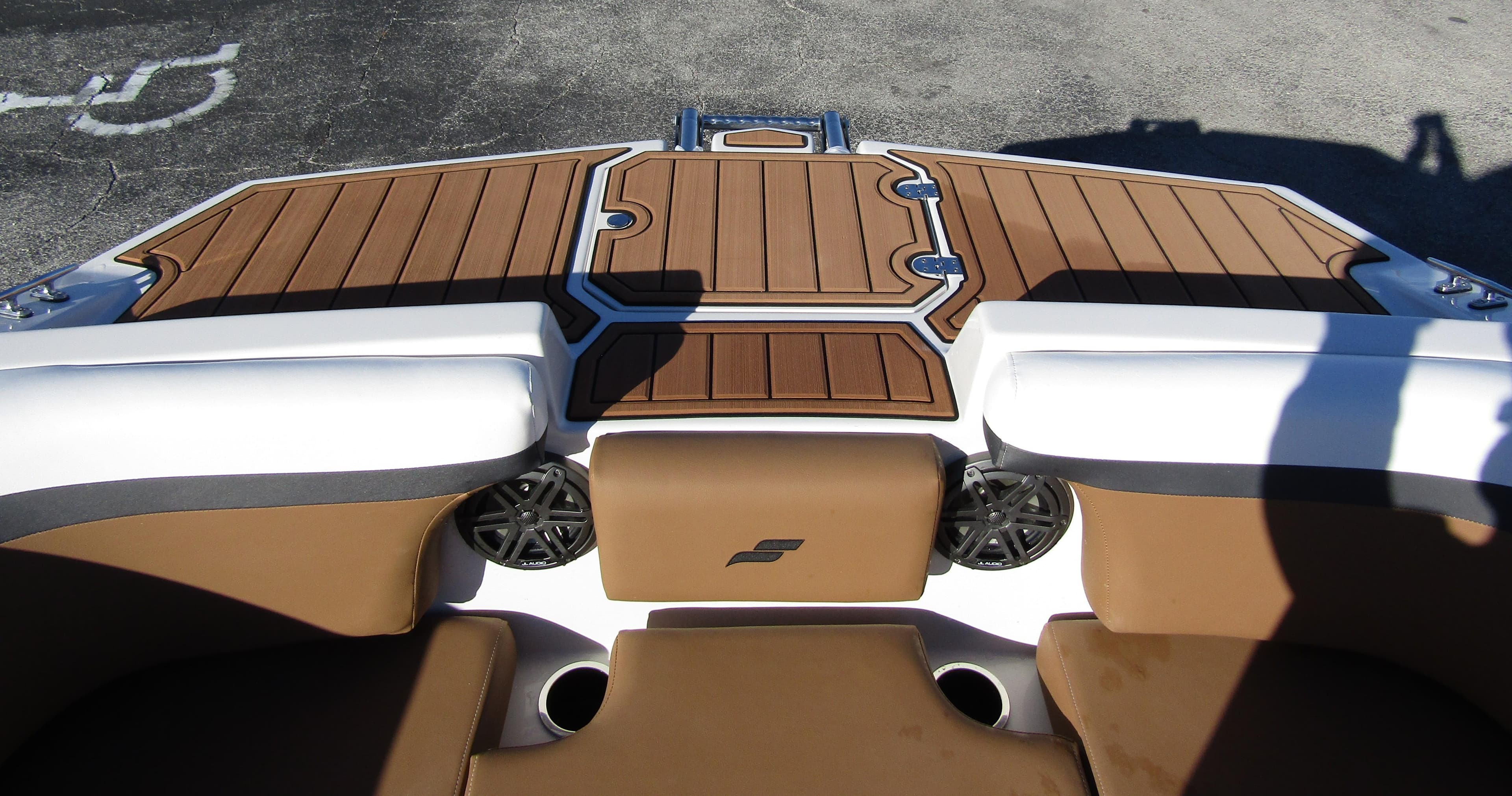 2024 Starcraft SVX 231 OB CC boat interior with brown and white seating.