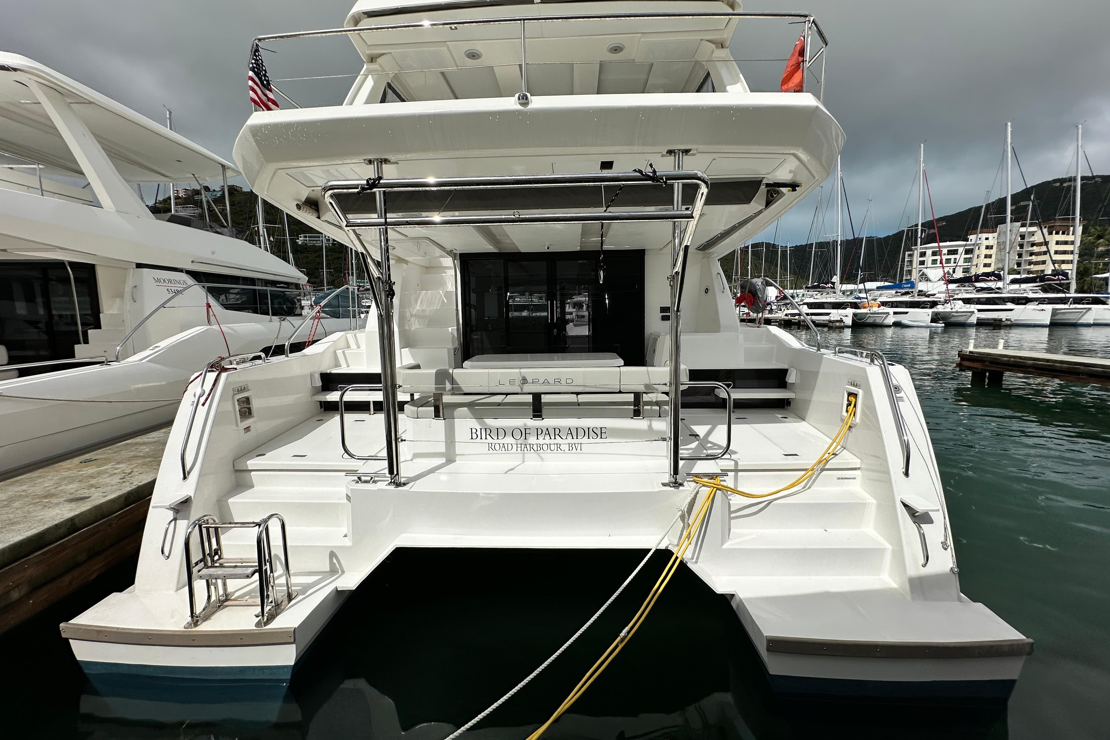 2025 Robertson and Caine Leopard 40 Powercat docked at marina, rear view.
