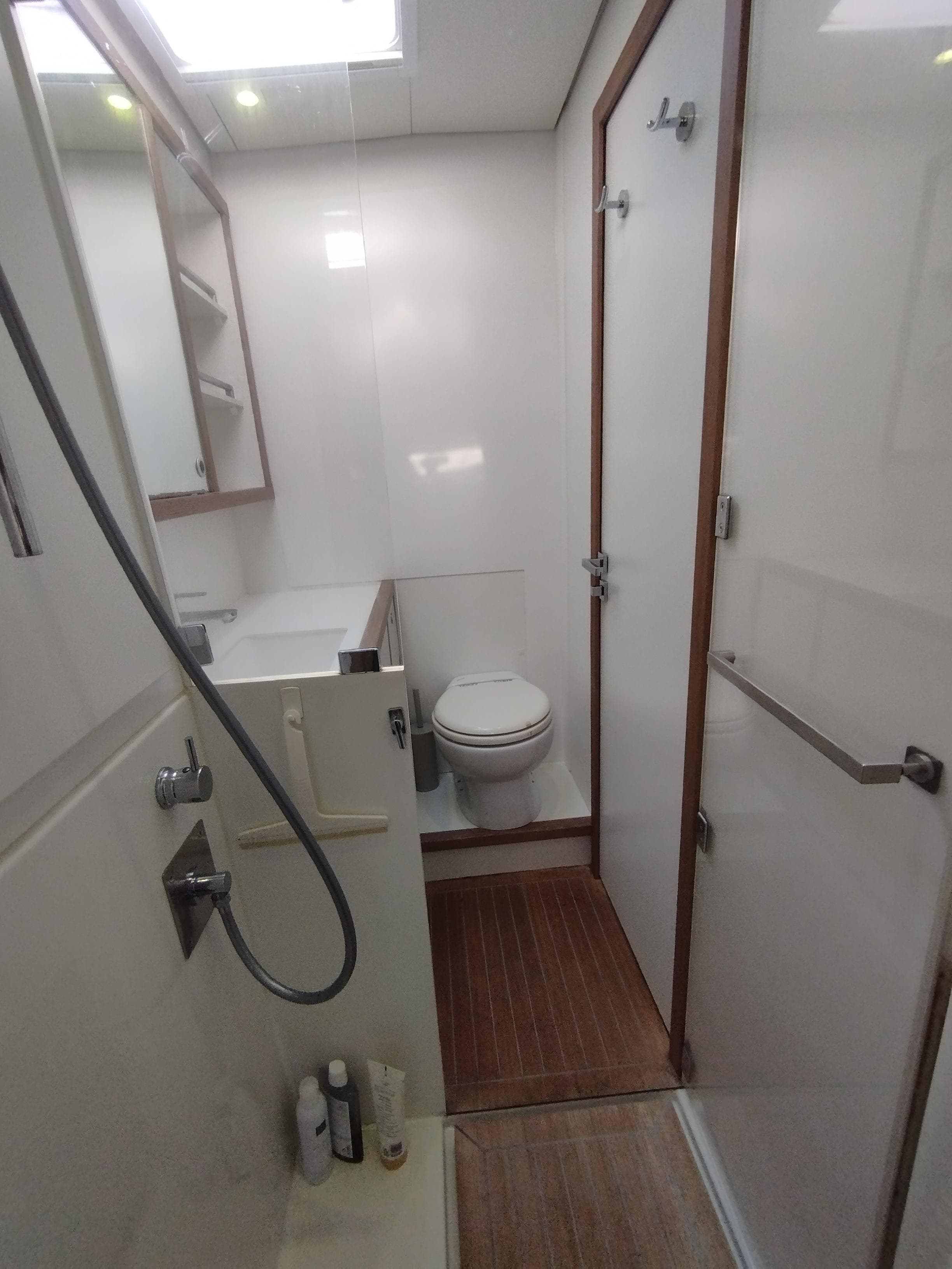 Bathroom interior of 2012 Lagoon 620 yacht with shower and toilet.