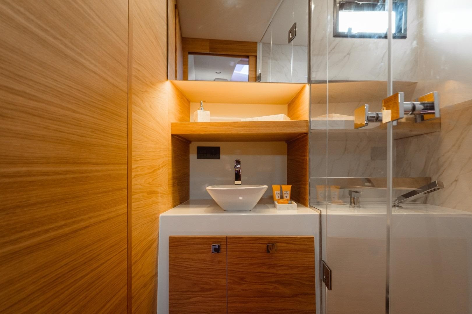 Luxurious bathroom interior of 2026 De Antonio Yachts 50 Open, featuring modern wood and marble design.