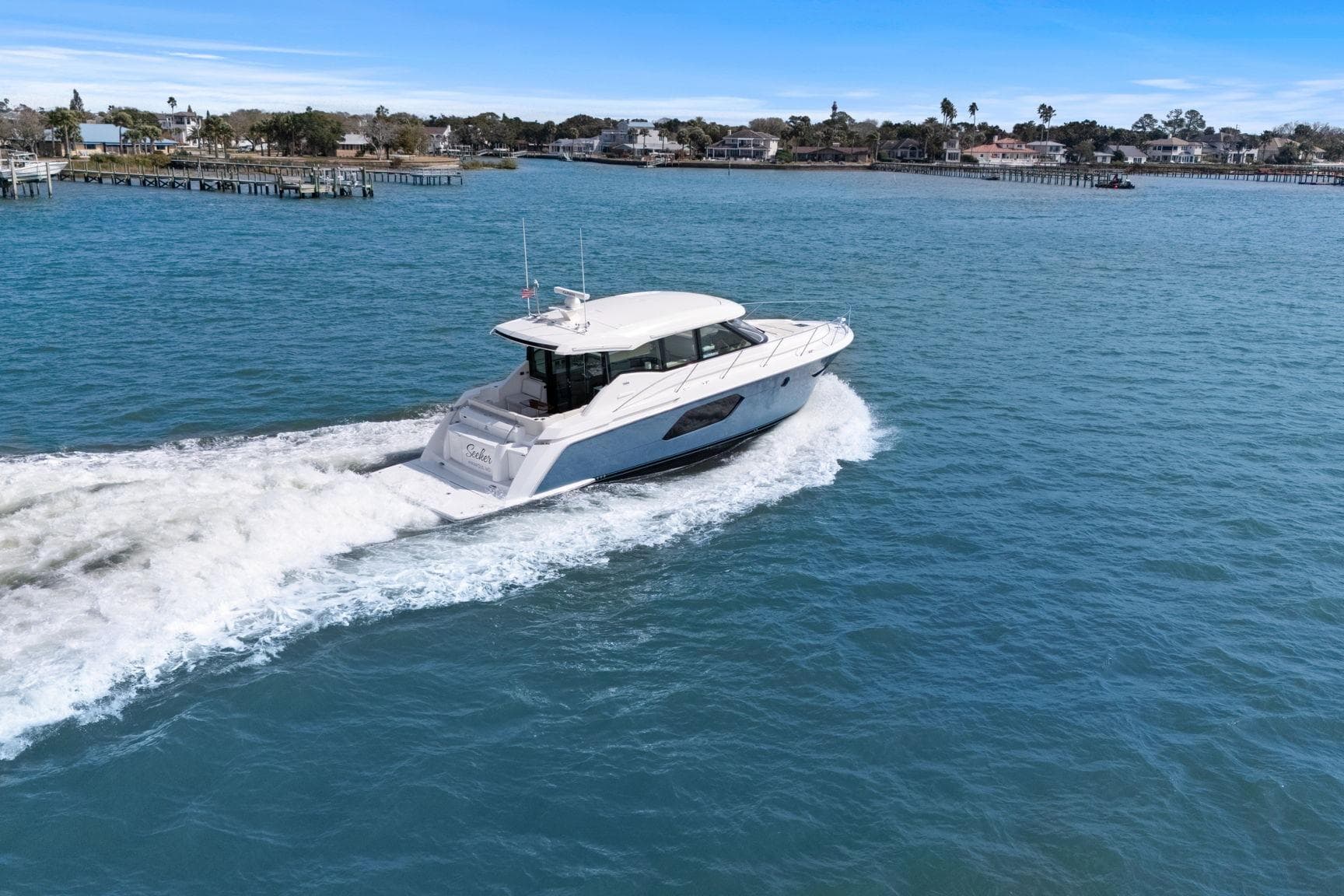 2023 Tiara Yachts C49 Coupe cruising on open water.