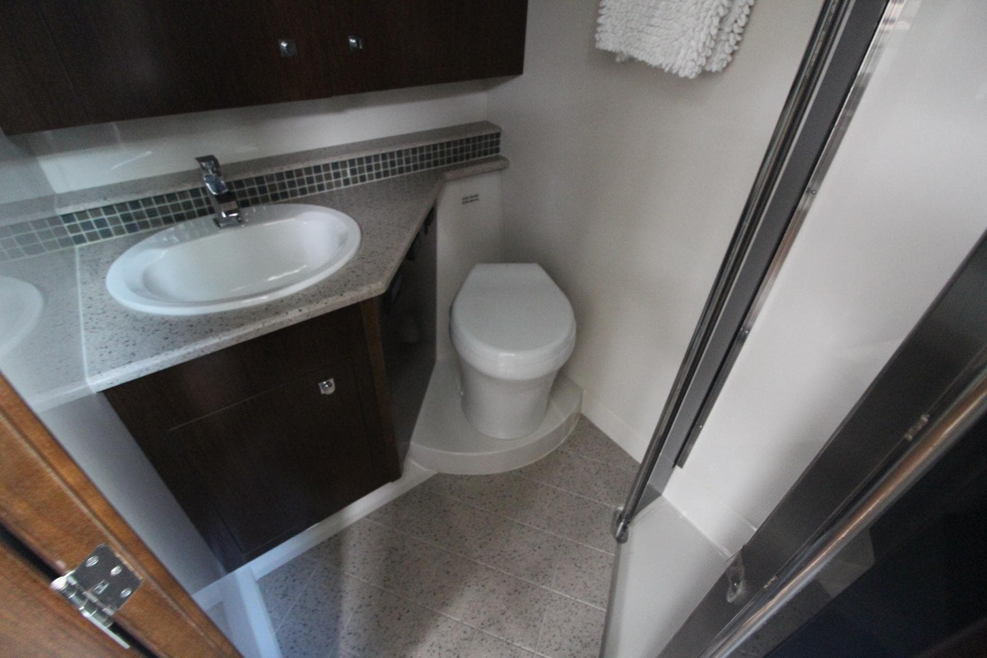 Bathroom interior of 2013 Cruisers Yachts 430 SC, featuring sink and toilet.