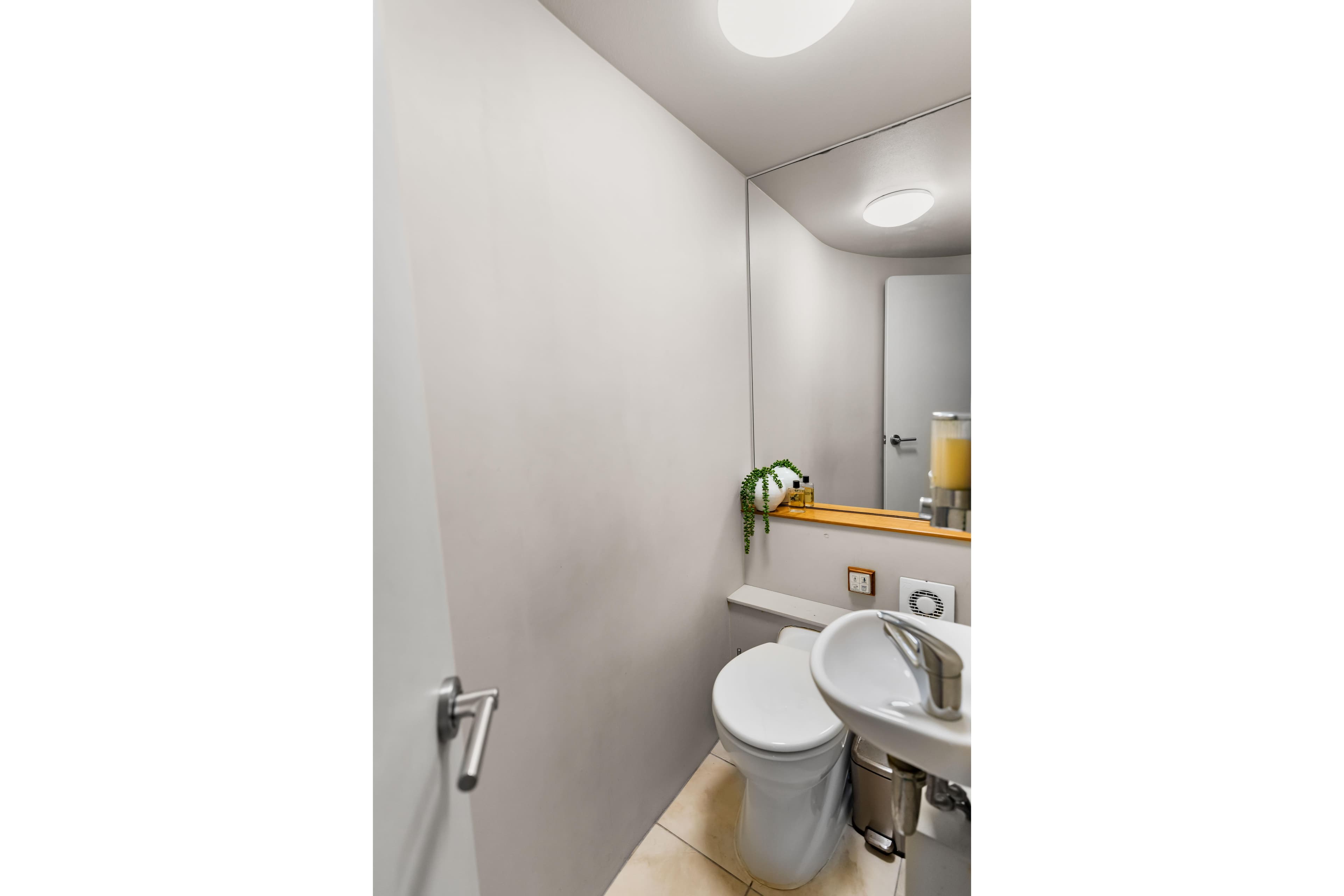 Modern yacht bathroom with sleek fixtures, mirror, and minimalist design, 2012 Custom Expedition Yacht.