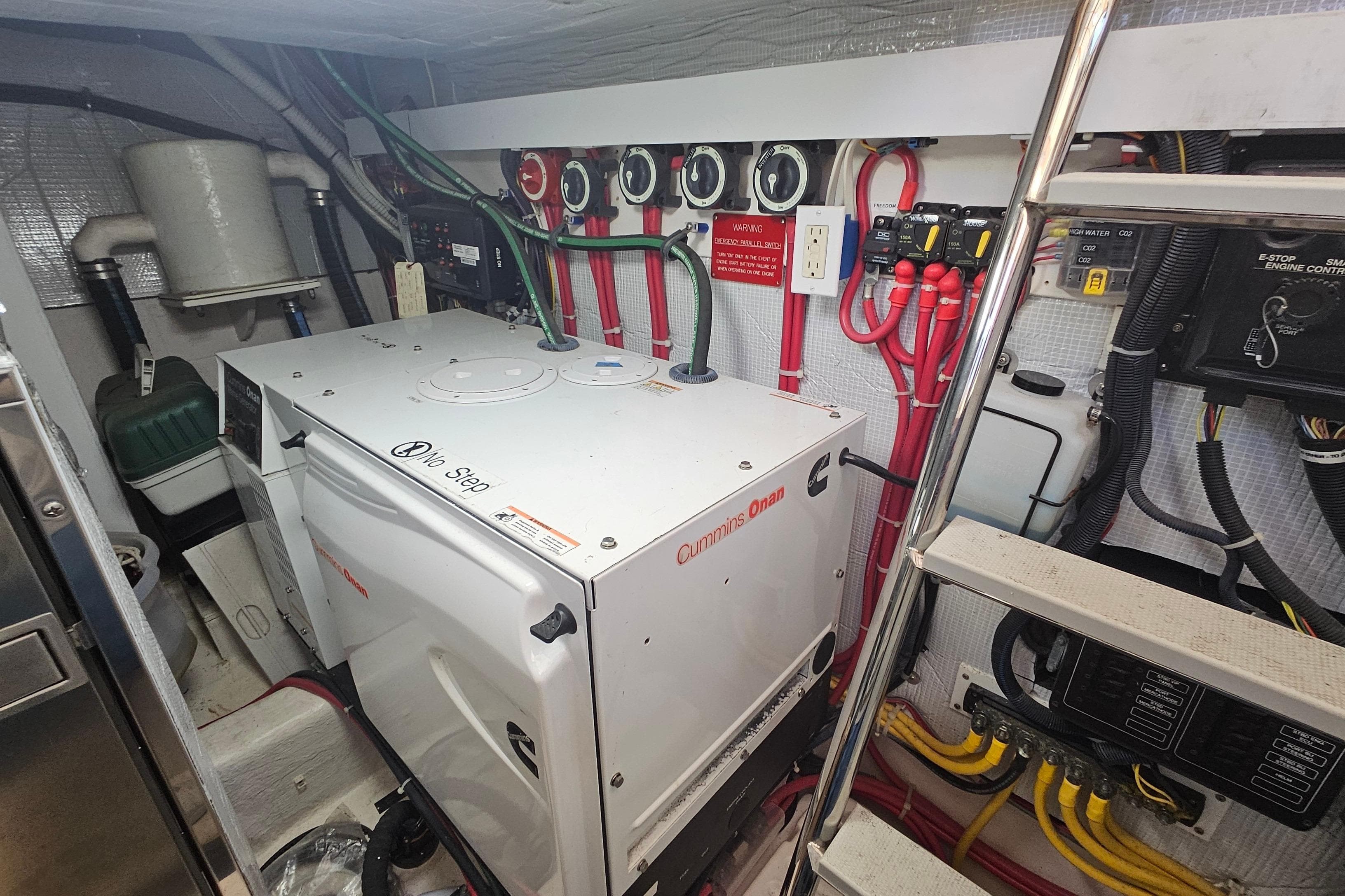 Engine room of 2009 Sabre 42 Express with Cummins Onan generator and wiring.