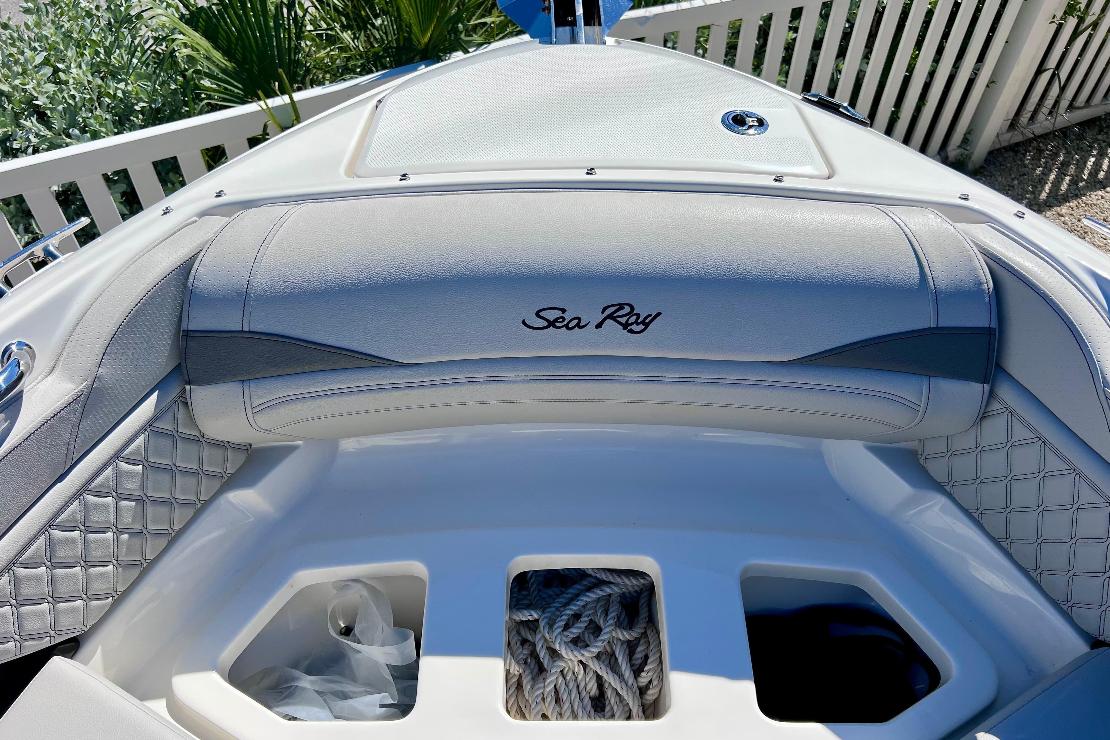 2024 Sea Ray SLX 260 Outboard boat interior with storage compartments and elegant seating.