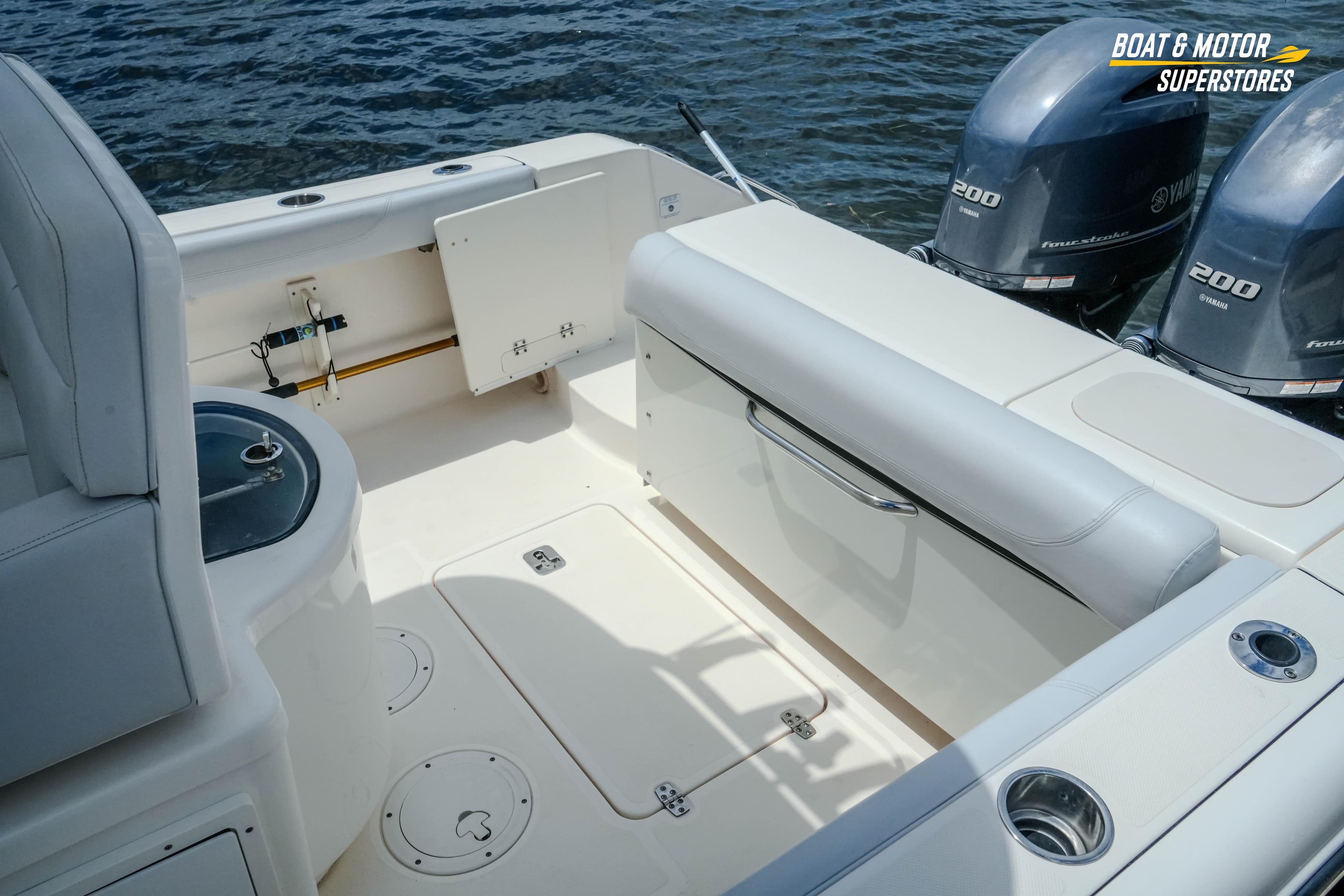 2016 Pursuit C 260 Center Console boat interior with Yamaha engines, featuring seating and storage.