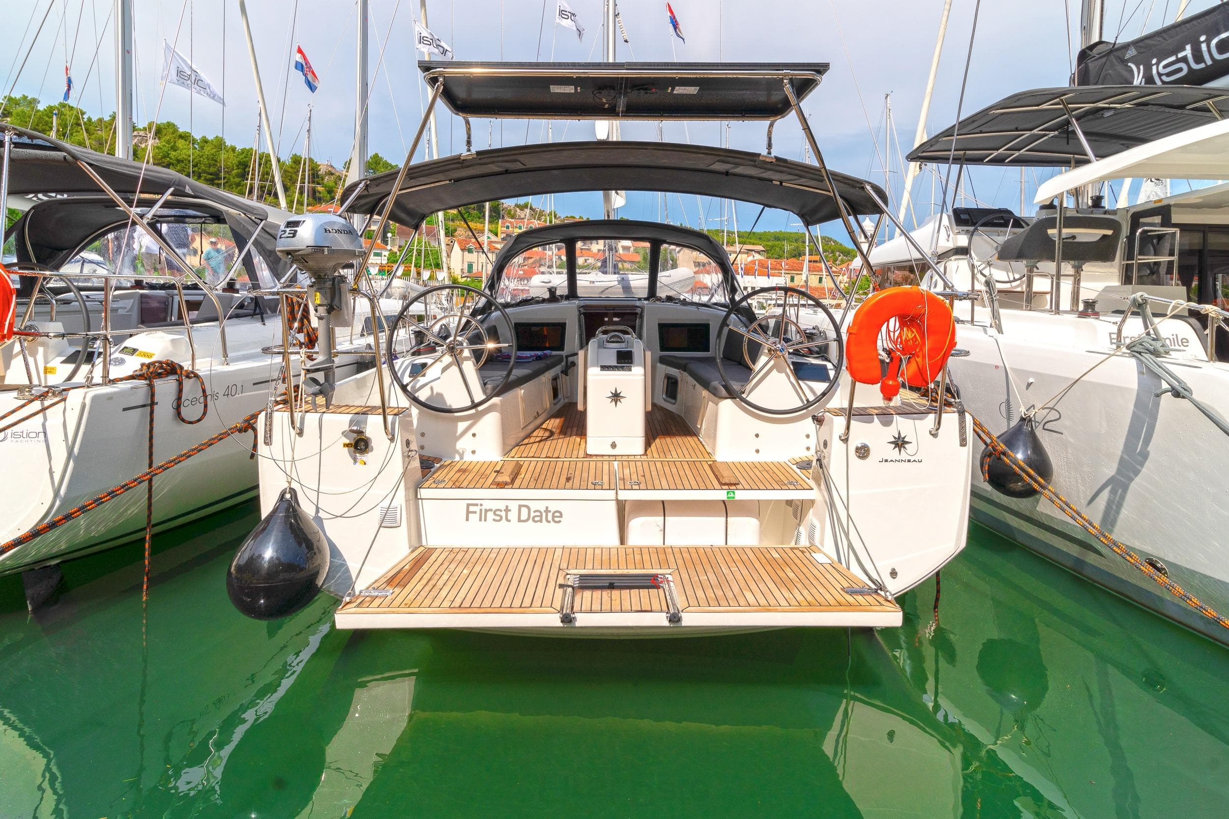 Jeanneau Sun Odyssey 410 yacht, 2023 model, docked in a marina.