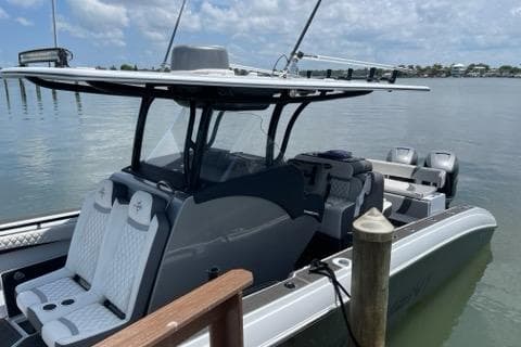 2019 Statement 350 Open boat docked on calm water.