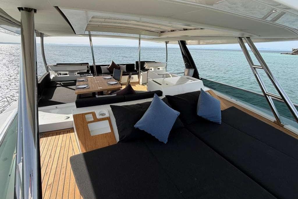 Luxurious 2019 Lagoon 630 MY yacht interior with elegant seating and ocean view.