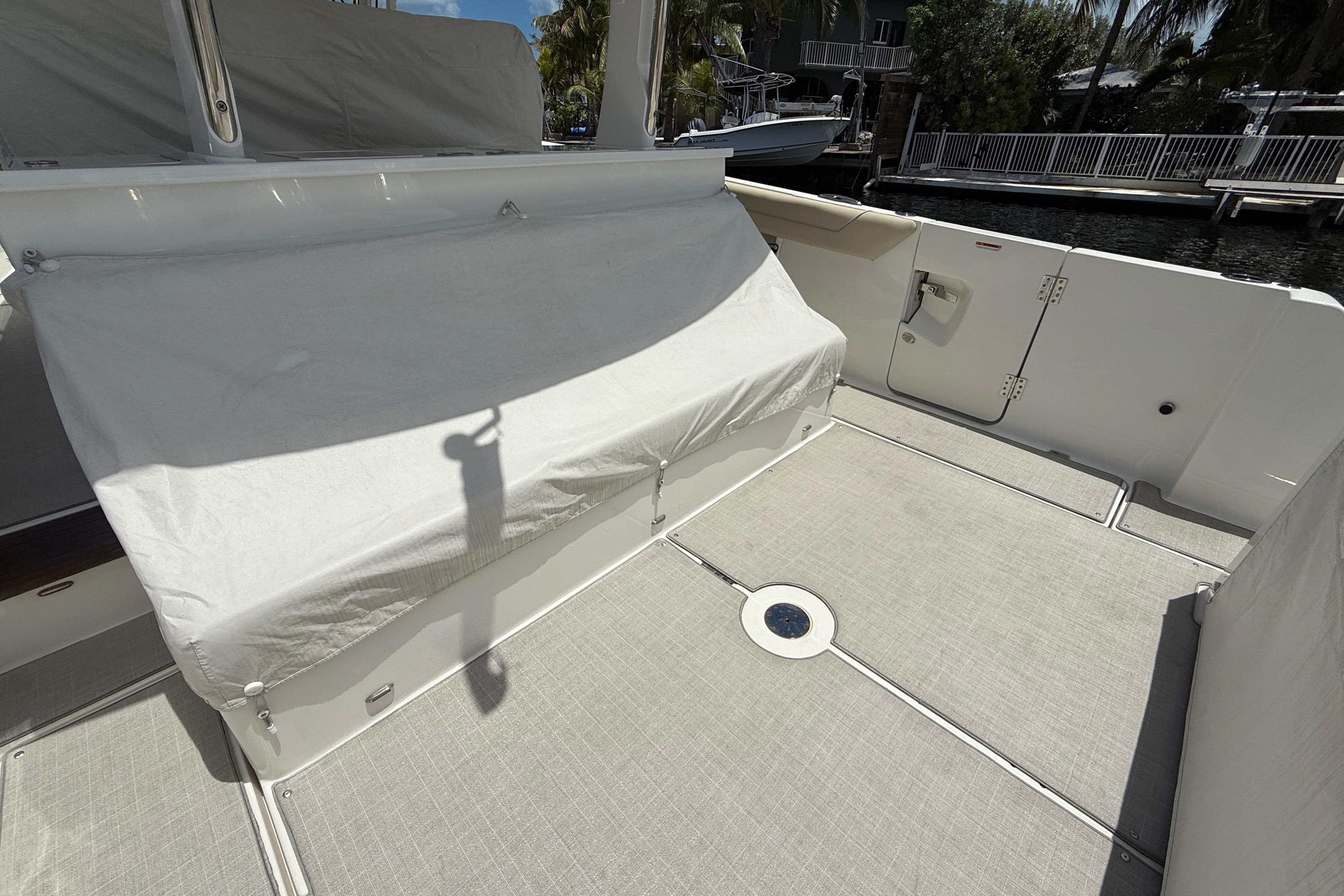 2022 Regal 38 SAV boat deck with covered seating and clean flooring.