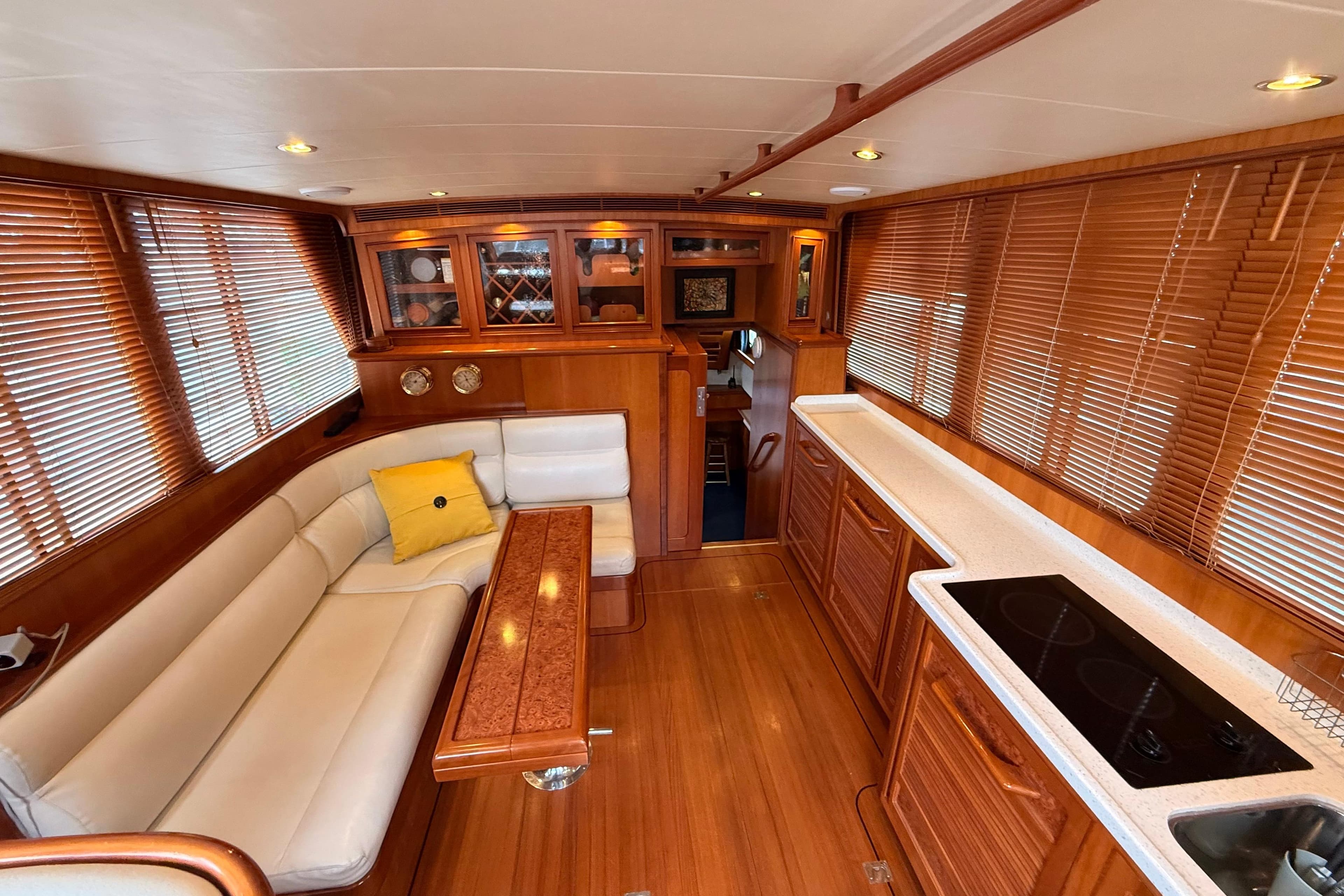 Luxurious interior of a 2002 President Aft Cabin Trawler with elegant wood finishes.