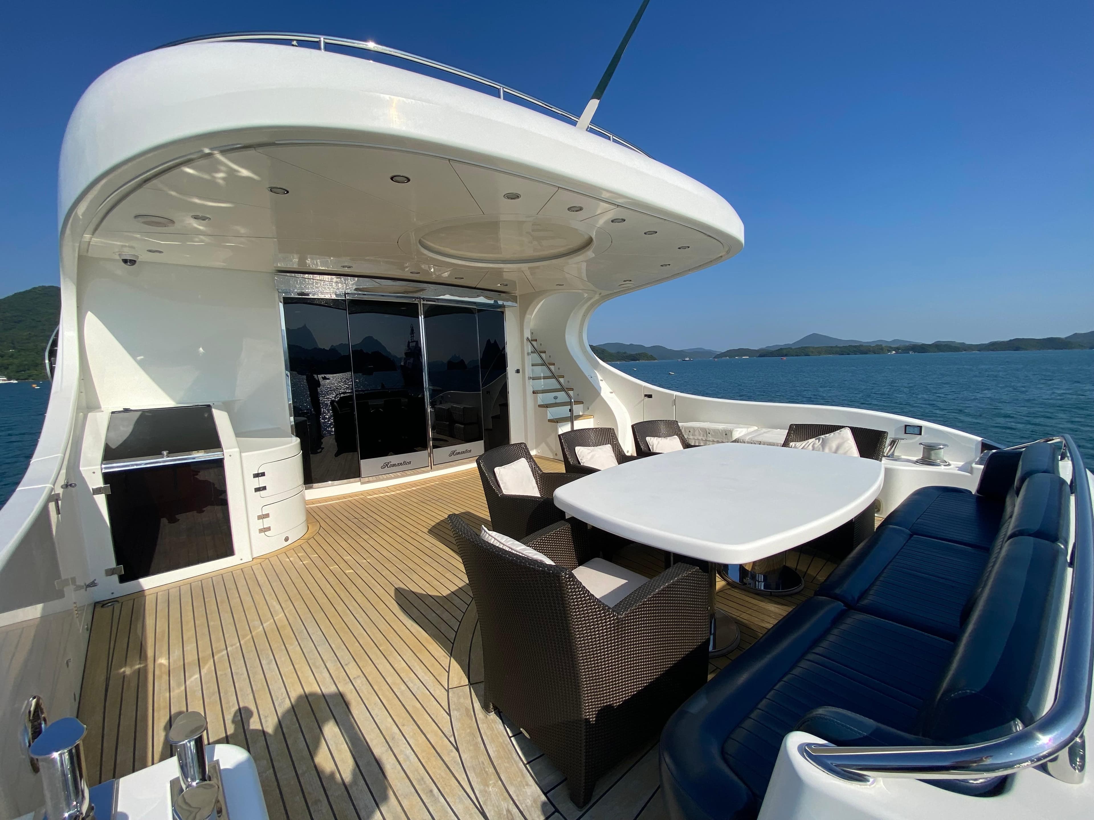 Luxurious 2007 Platinum PR Marine Romantica 103 yacht deck with seating and ocean view.