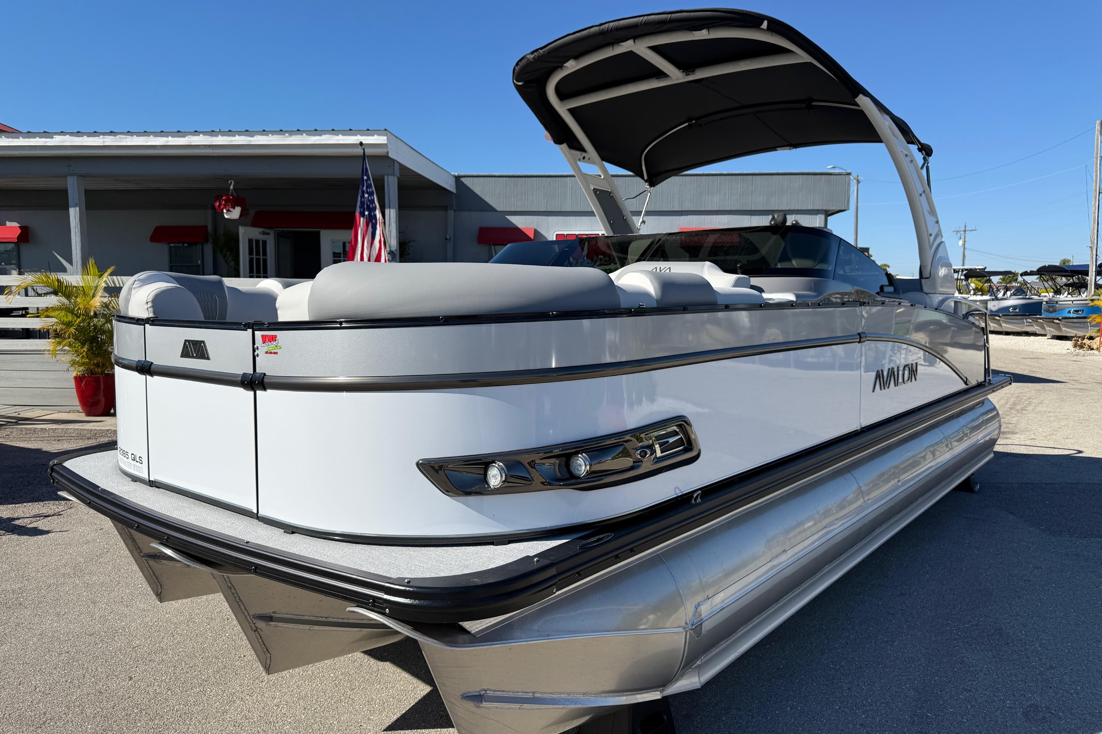 2026 Avalon 2385 Catalina Windshield Quade Lounger, Tri Toon, High Performance boat in showroom.