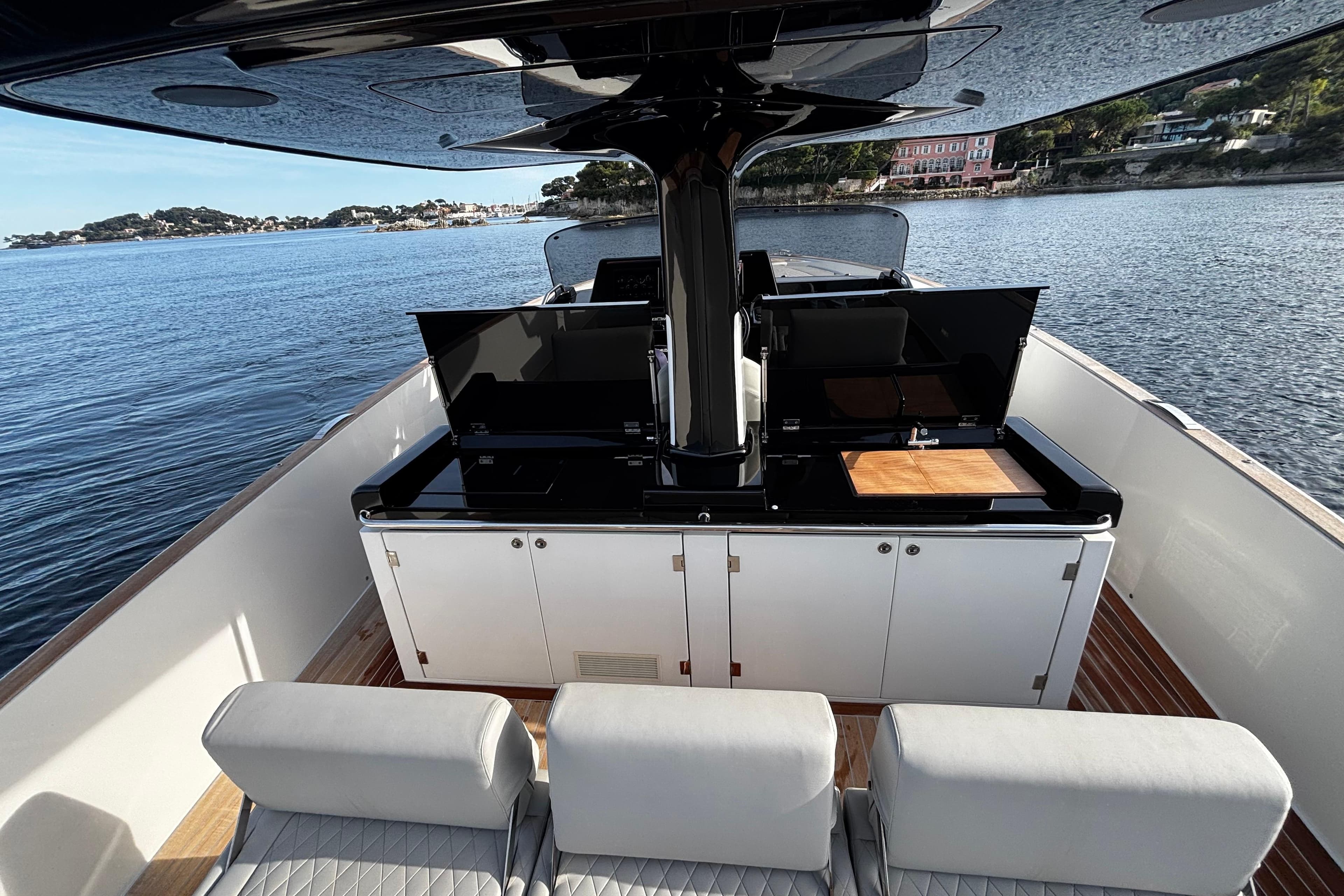 Luxurious 2024 Solaris 44 yacht interior with sleek kitchen and scenic ocean view.