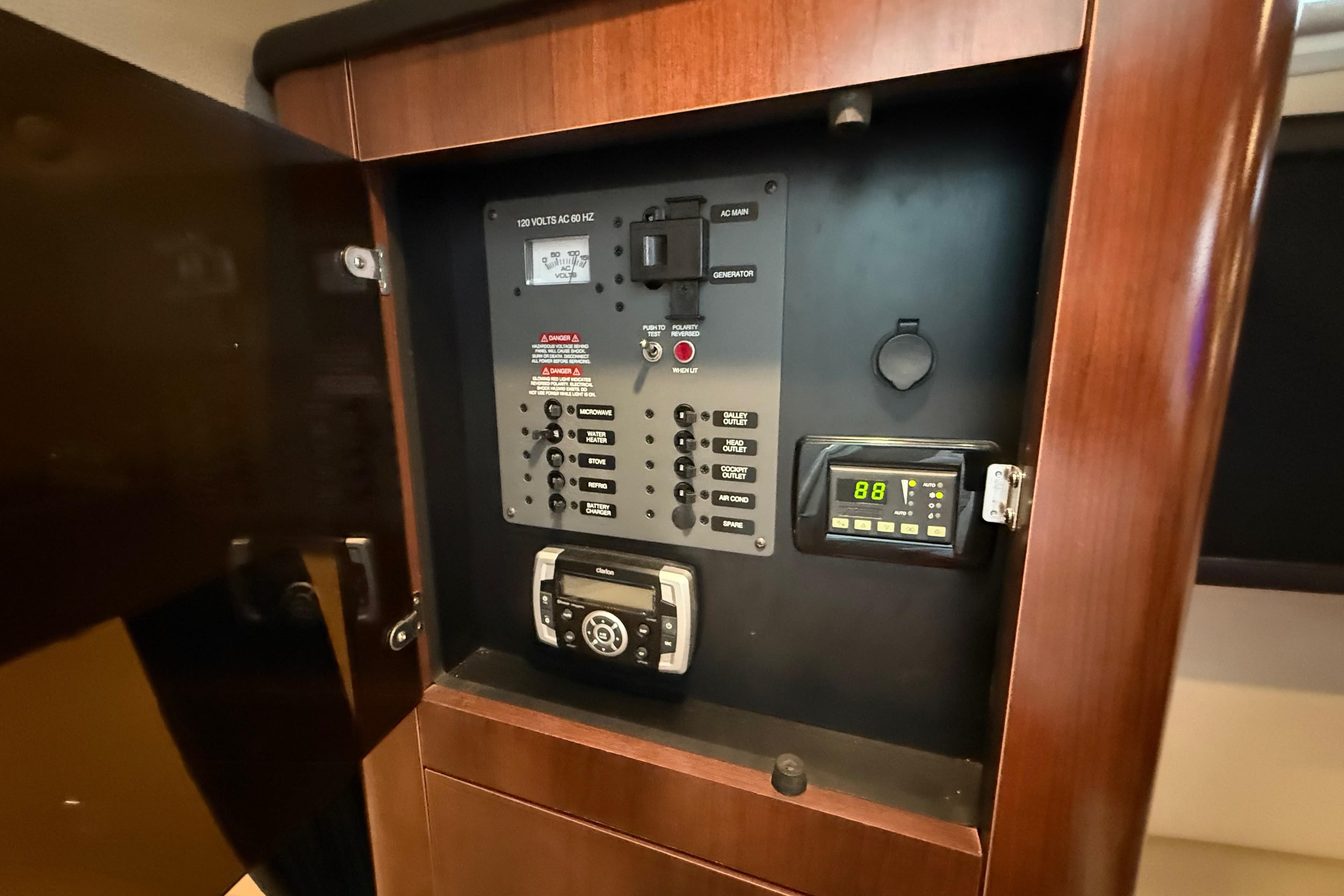 Control panel inside 2016 Chaparral 290 Signature boat, featuring various switches and displays.