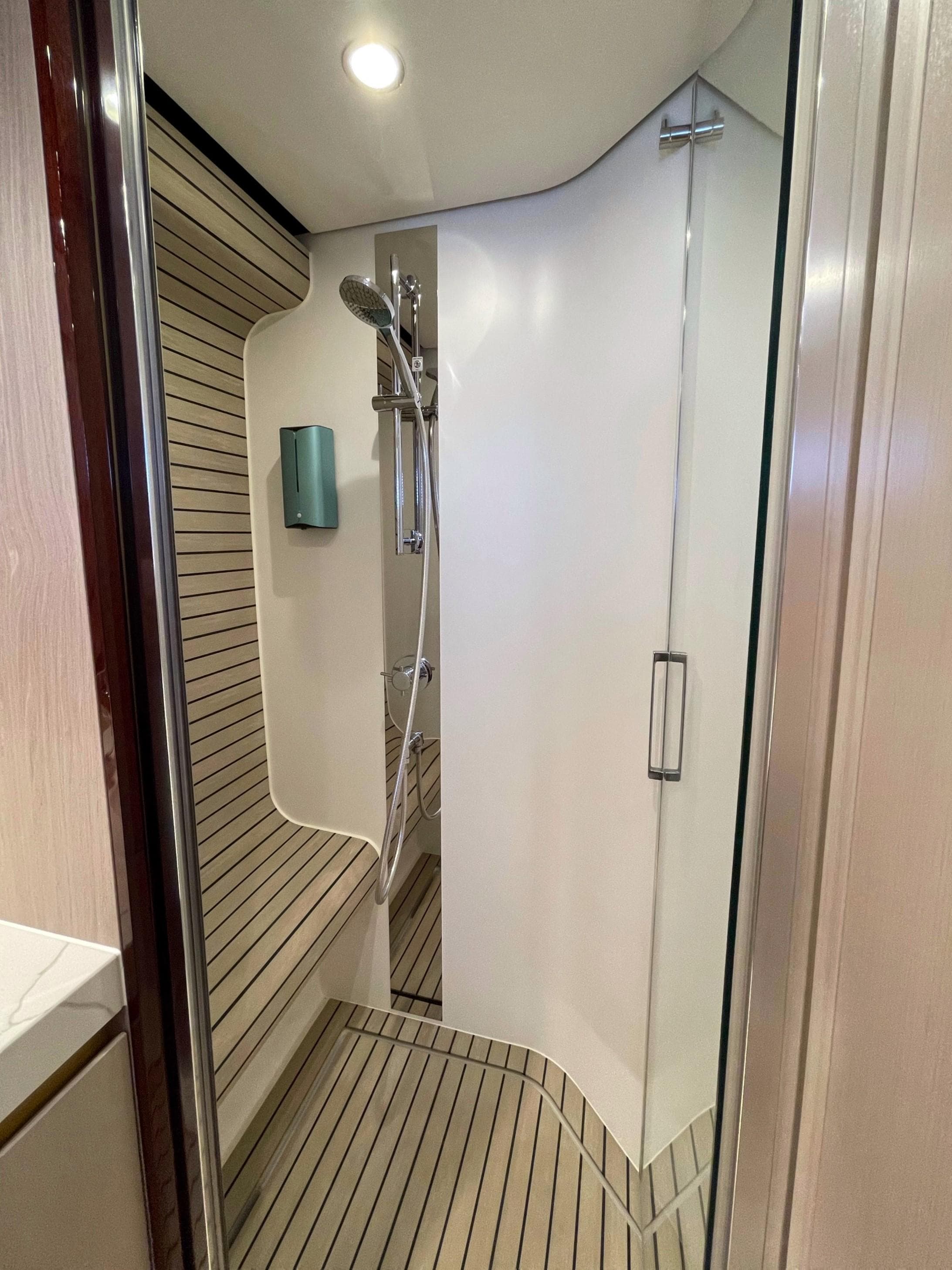 Azimut 60 yacht shower interior, 2020 model, featuring sleek design and modern fixtures.