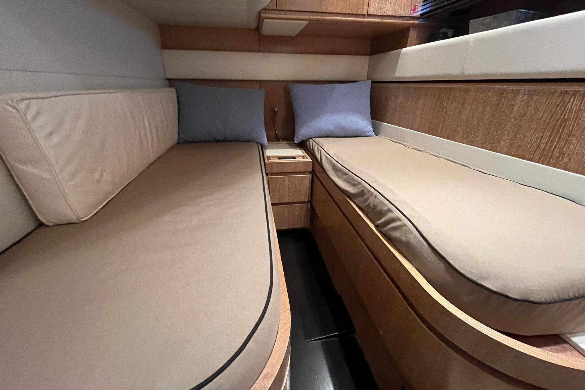 Interior cabin of 2007 Rizzardi Incredible 45 yacht with twin beds and wooden finish.