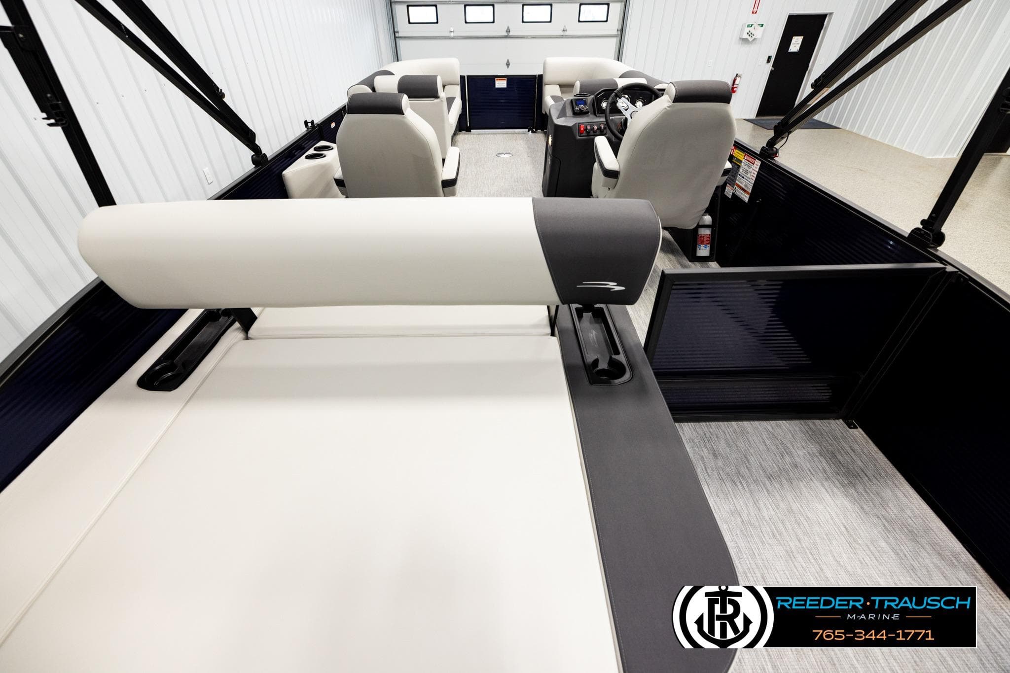 Interior view of 2026 Bennington 22 SSBSF pontoon boat with seating and helm.