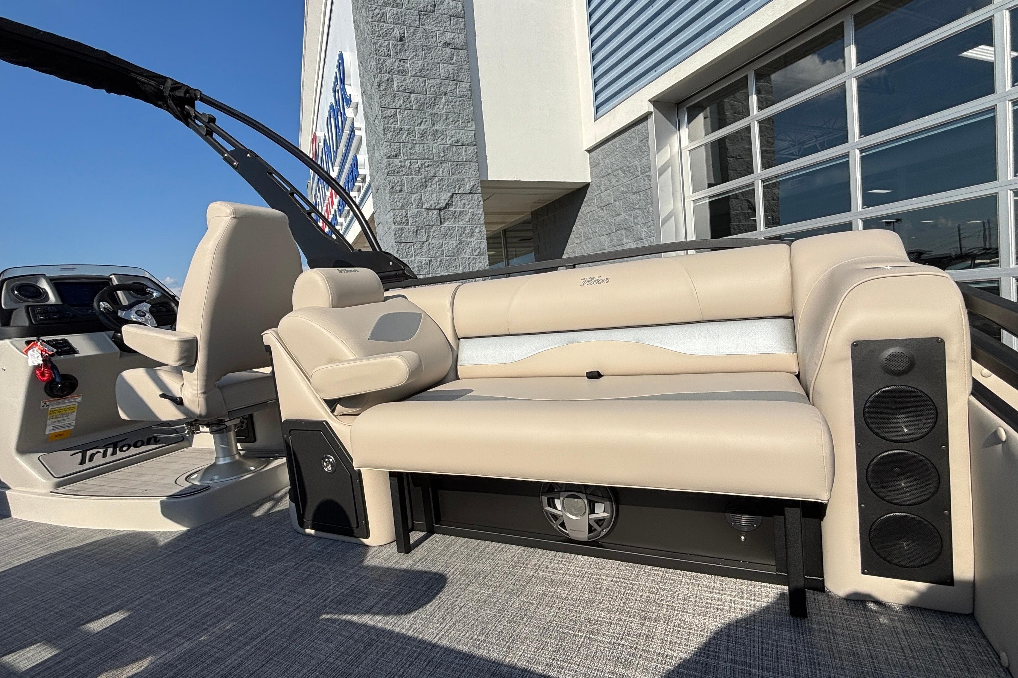 2026 JC Neptoon 25TT Sport boat interior with beige seating and modern dashboard.