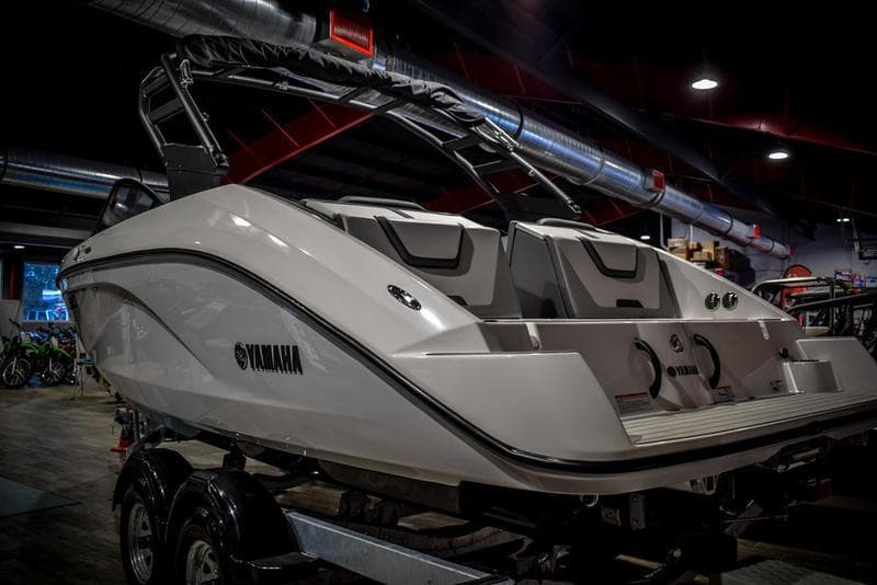 2023 Yamaha Boats AR220 in showroom, rear view.