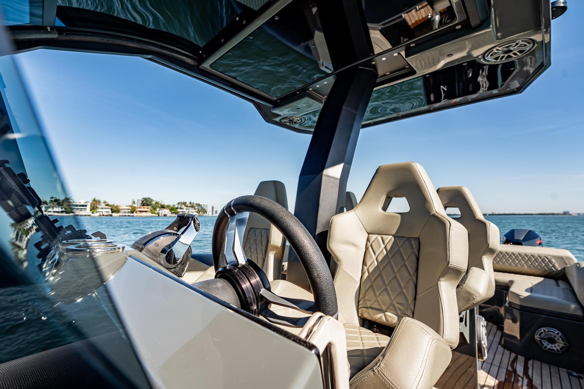 Luxurious 2023 Skipper-BSK 38NC boat interior with modern steering and plush seating.