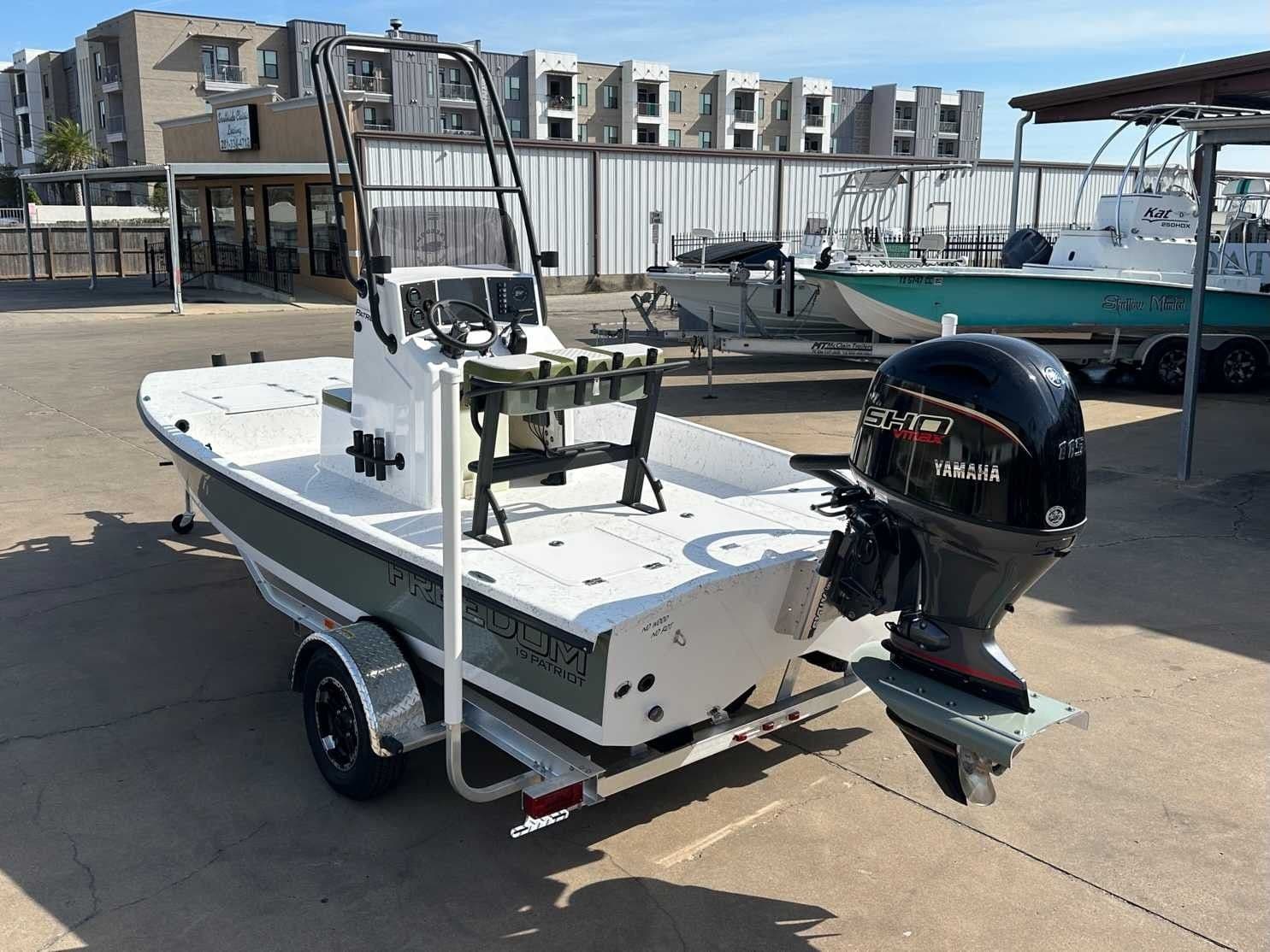 Freedom Boats Patriot 2026 with Yamaha motor on trailer.