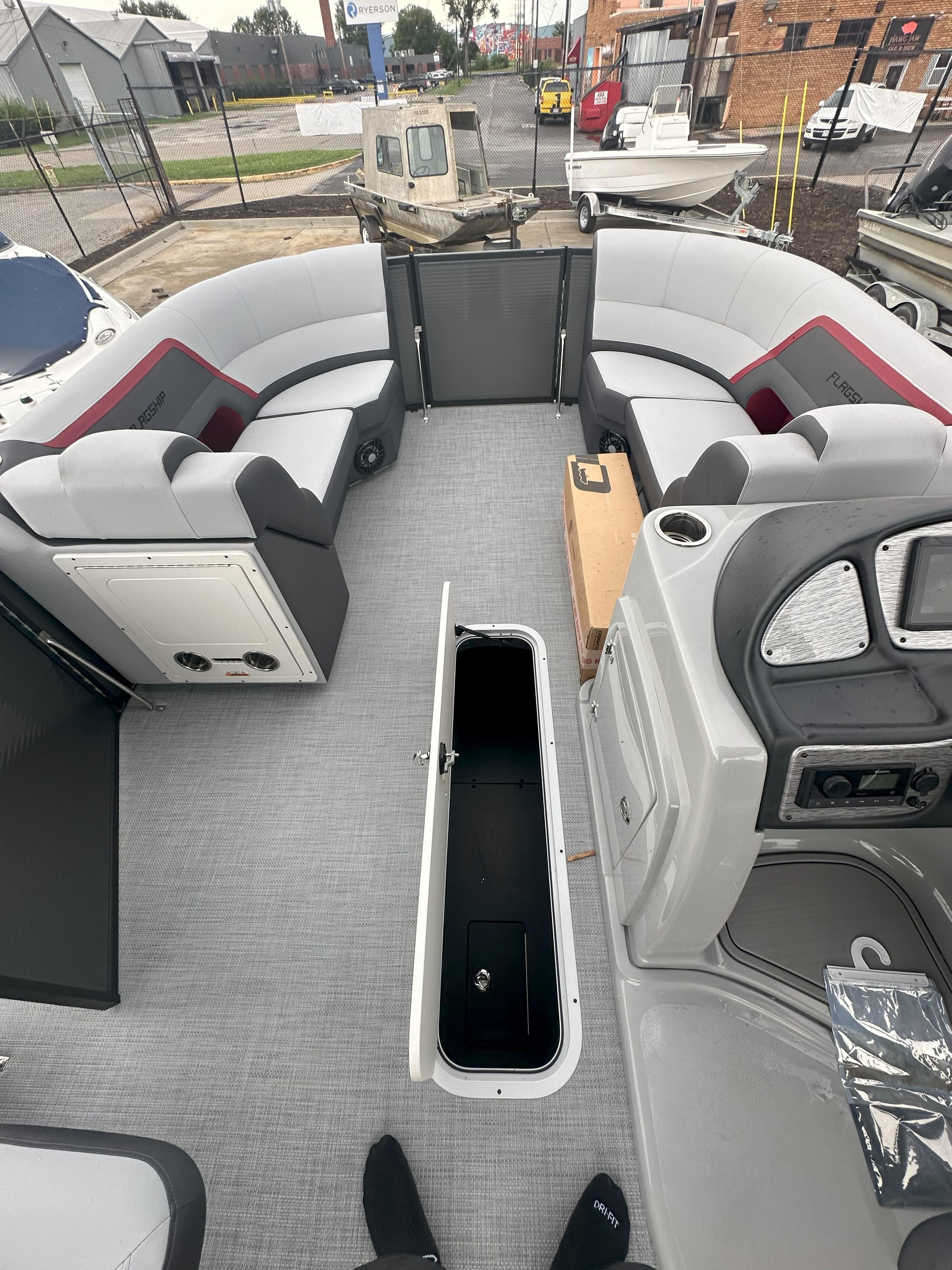Interior of 2026 Flagship D22CU Extended Deck boat with spacious seating and storage.