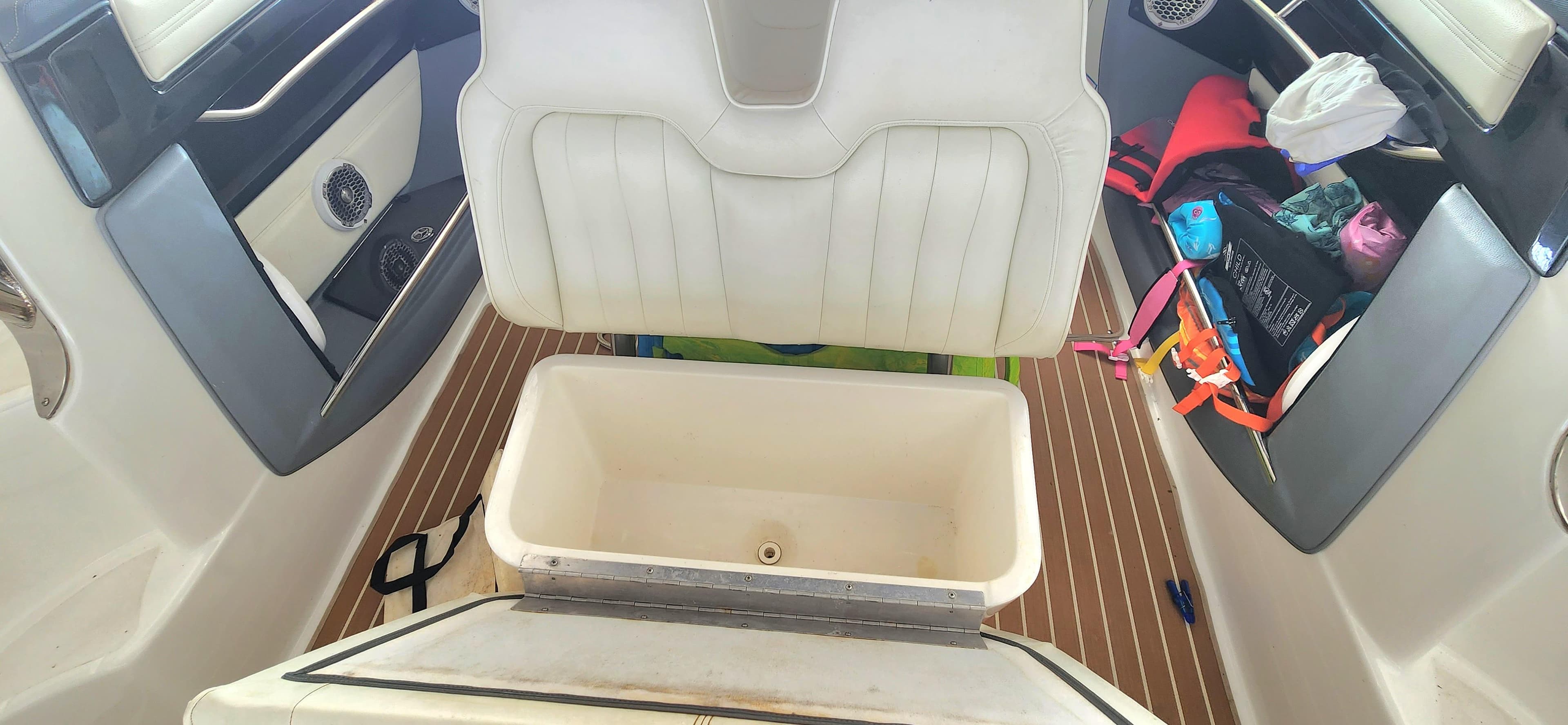 Interior of a 2007 Cobalt 343 boat with open storage compartment.