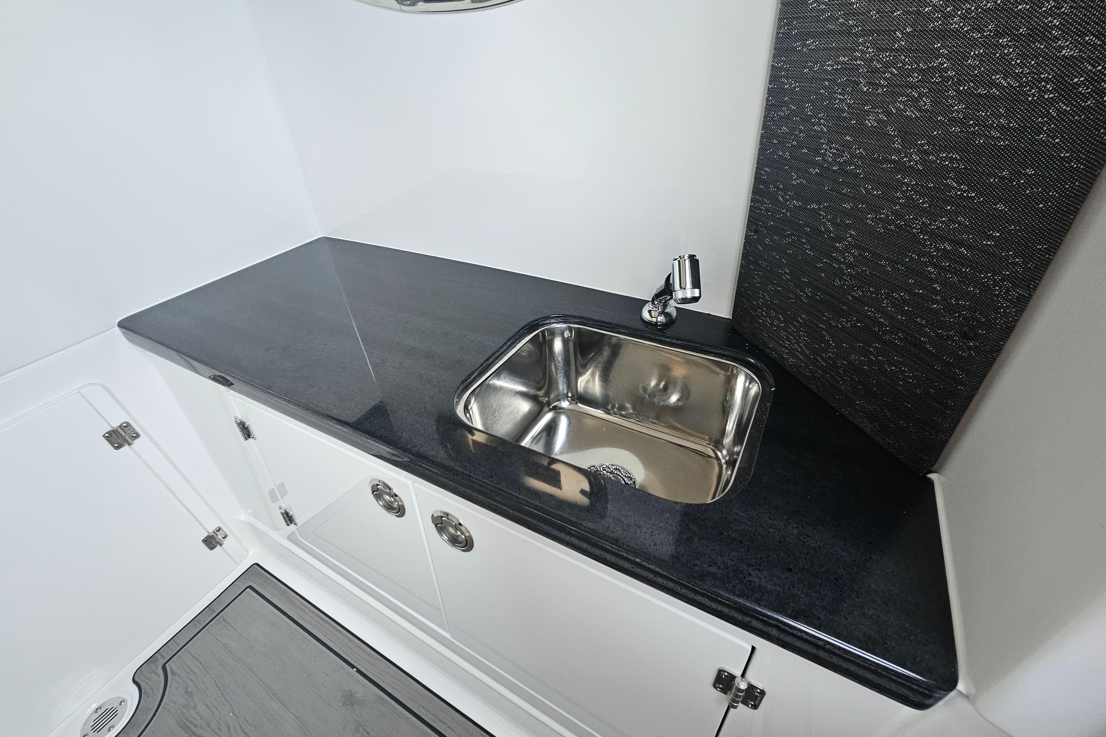 Luxury sink area in 2026 Monterey Elite 30 OB boat interior.