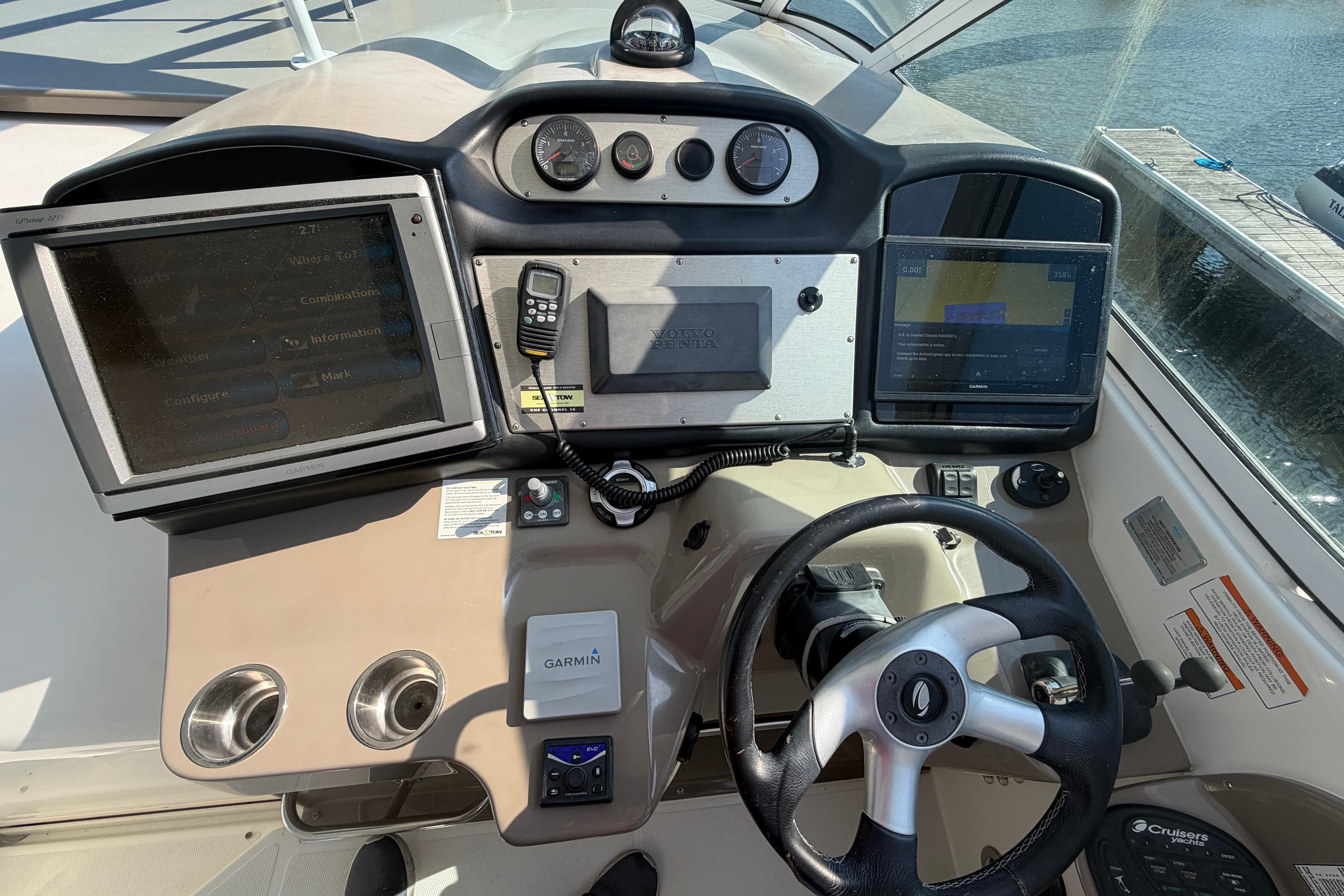 2011 Cruisers Yachts 415 Express Motoryacht helm with Garmin navigation and control systems.