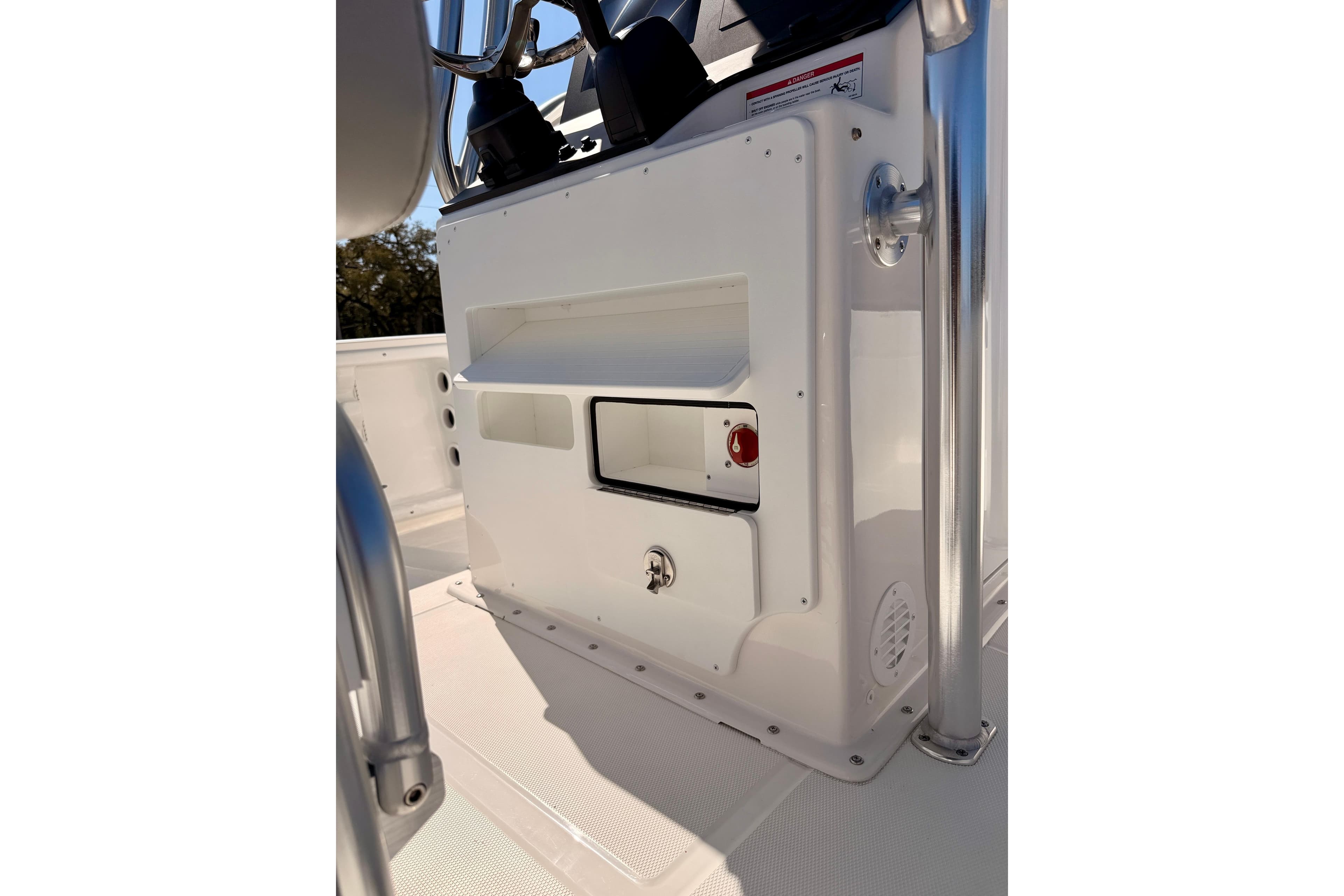 Bay Rider 2460 FS Skiff 2026 console detail with storage compartments and control panel.