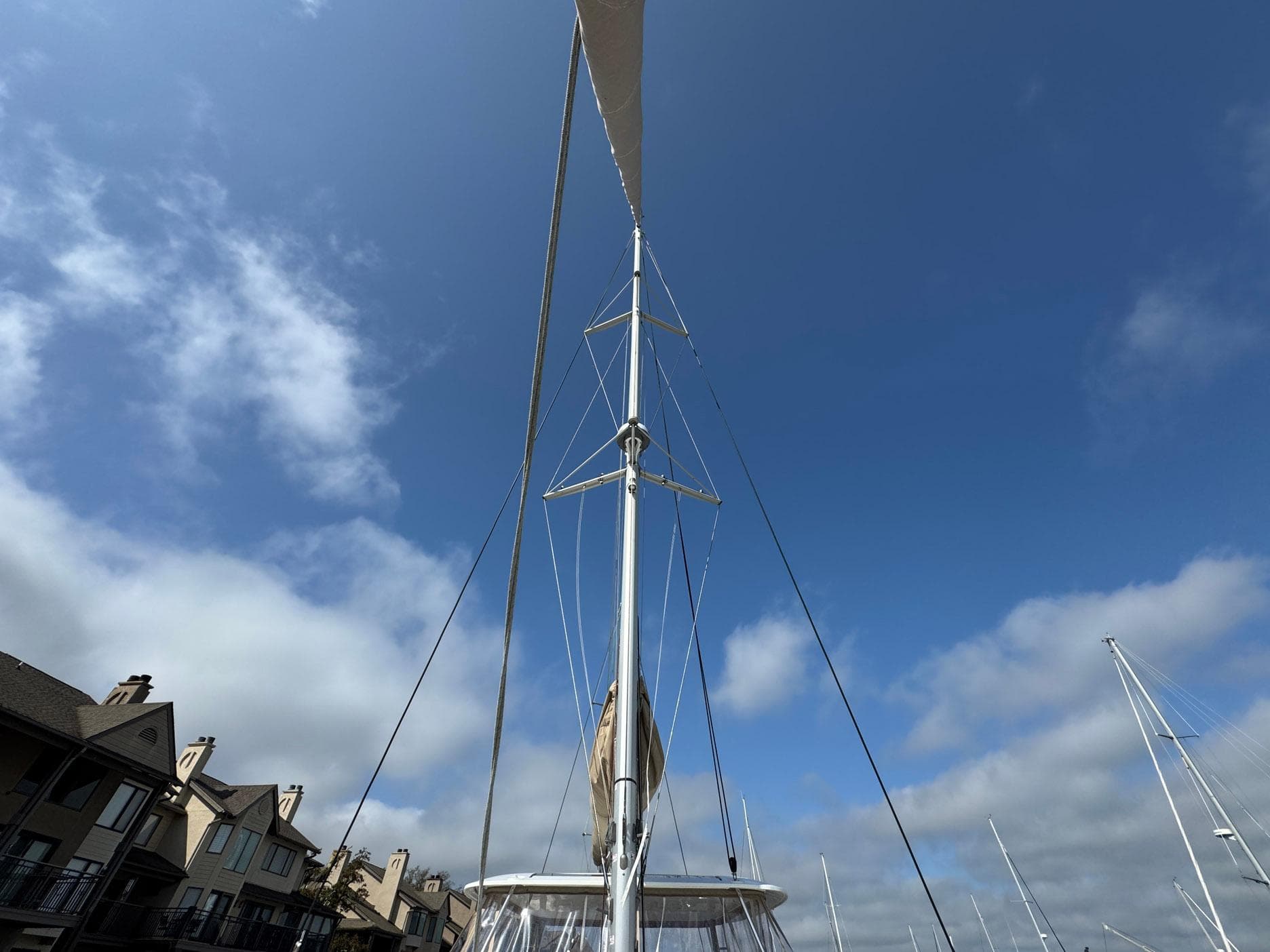 Sailboat mast of 2022 Lagoon 46 against a clear blue sky.