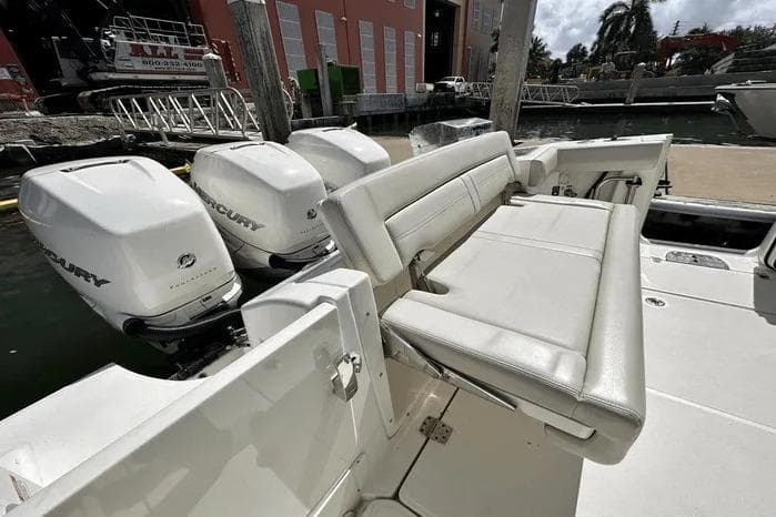 2019 Boston Whaler 350 Realm boat with triple Mercury outboard engines and comfortable seating.
