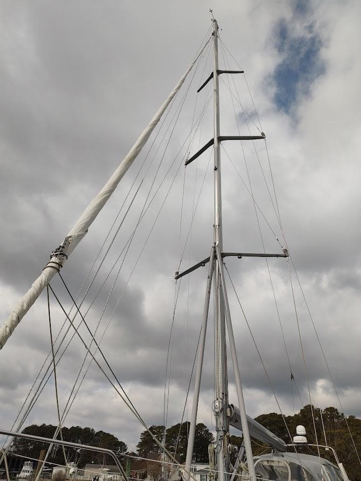 Sailboat mast of 2005 Stevens Custom 53/56 under cloudy sky.