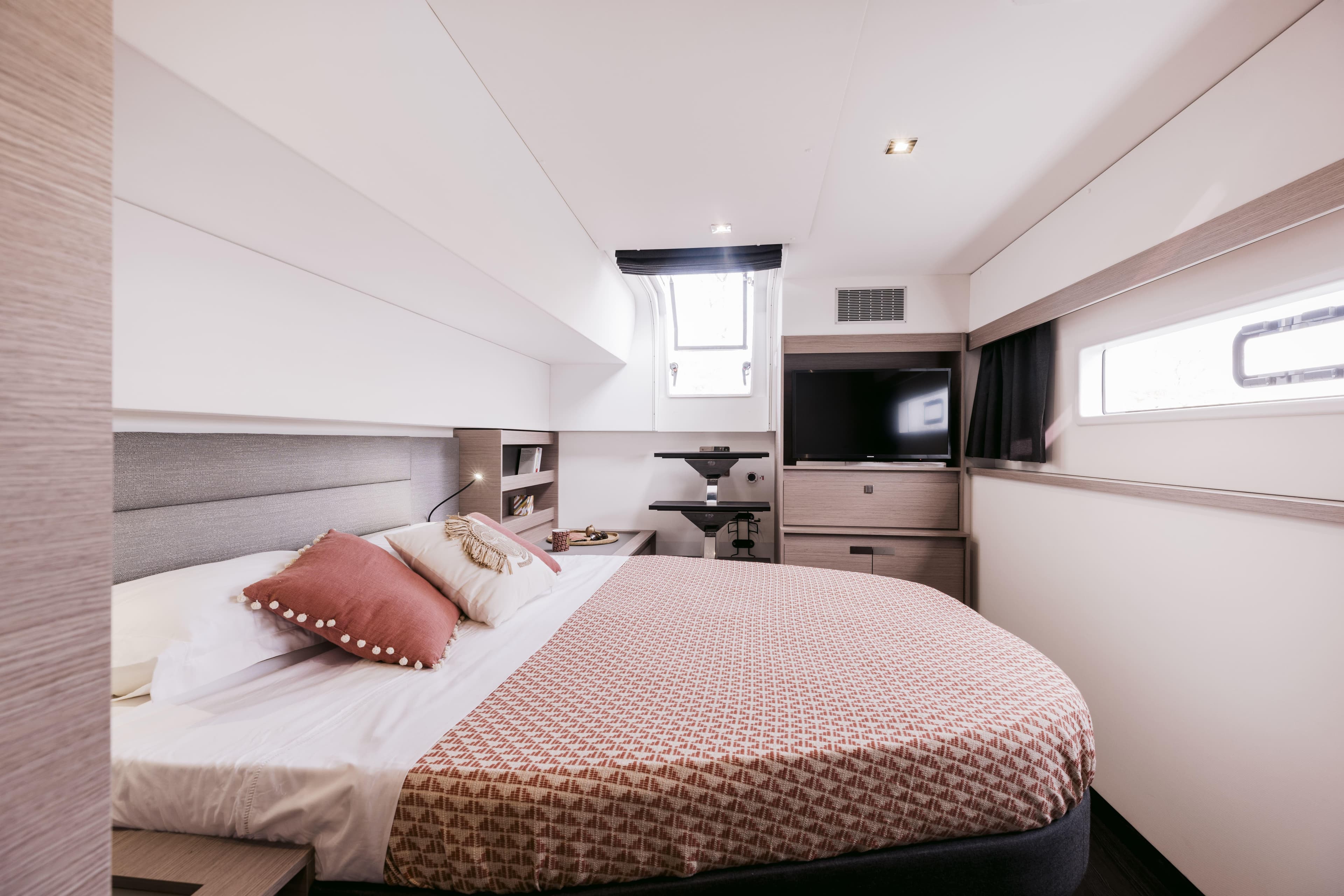 Luxurious cabin interior of 2025 Fountaine Pajot Aura 51 yacht with modern amenities.