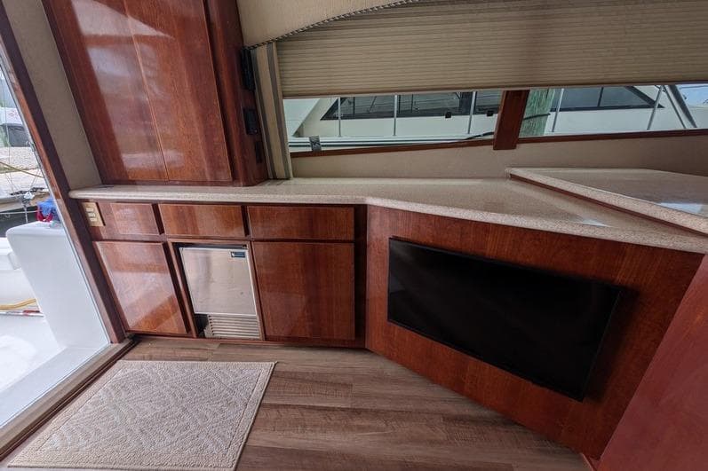 Interior of 2005 Egg Harbor 43 SportYacht with wooden cabinetry and countertop.