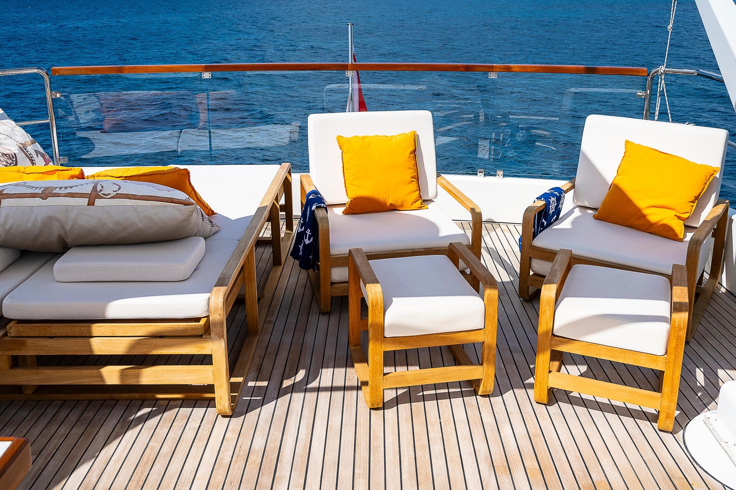 Luxurious deck seating on 1997 Sanlorenzo 82 yacht with ocean view.