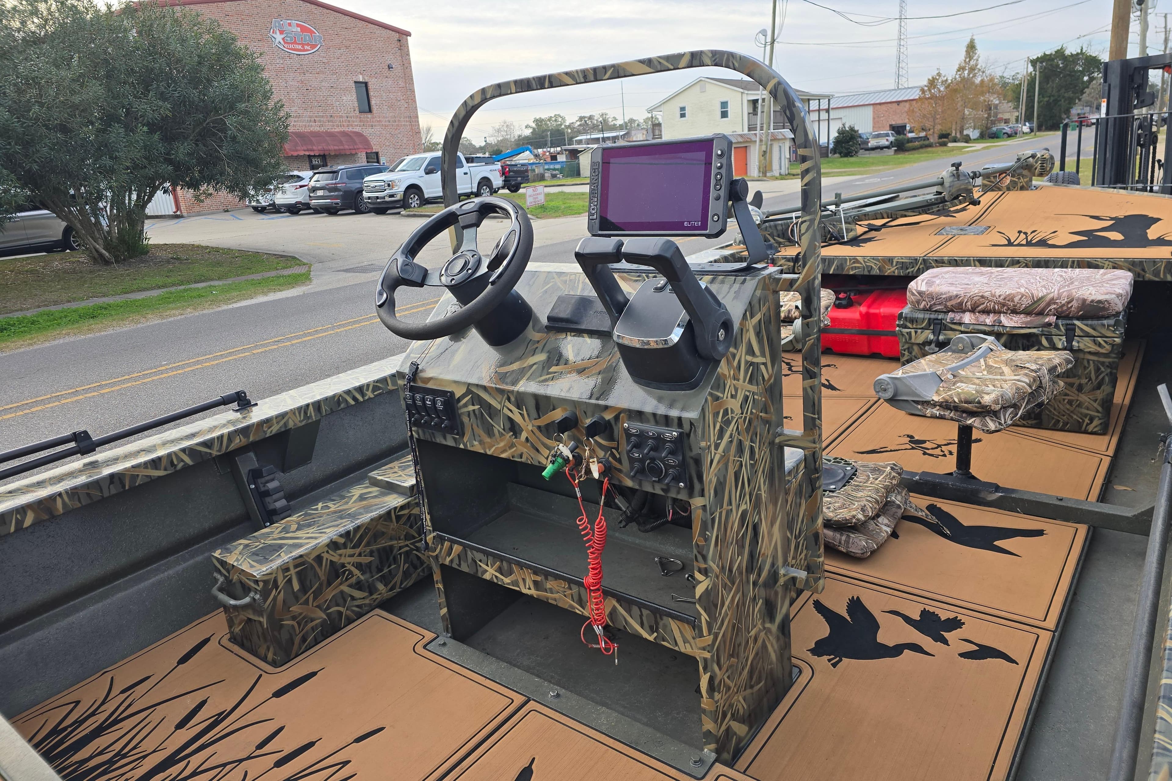 2023 Go-Devil 2072 boat interior with camouflage design and modern navigation equipment.