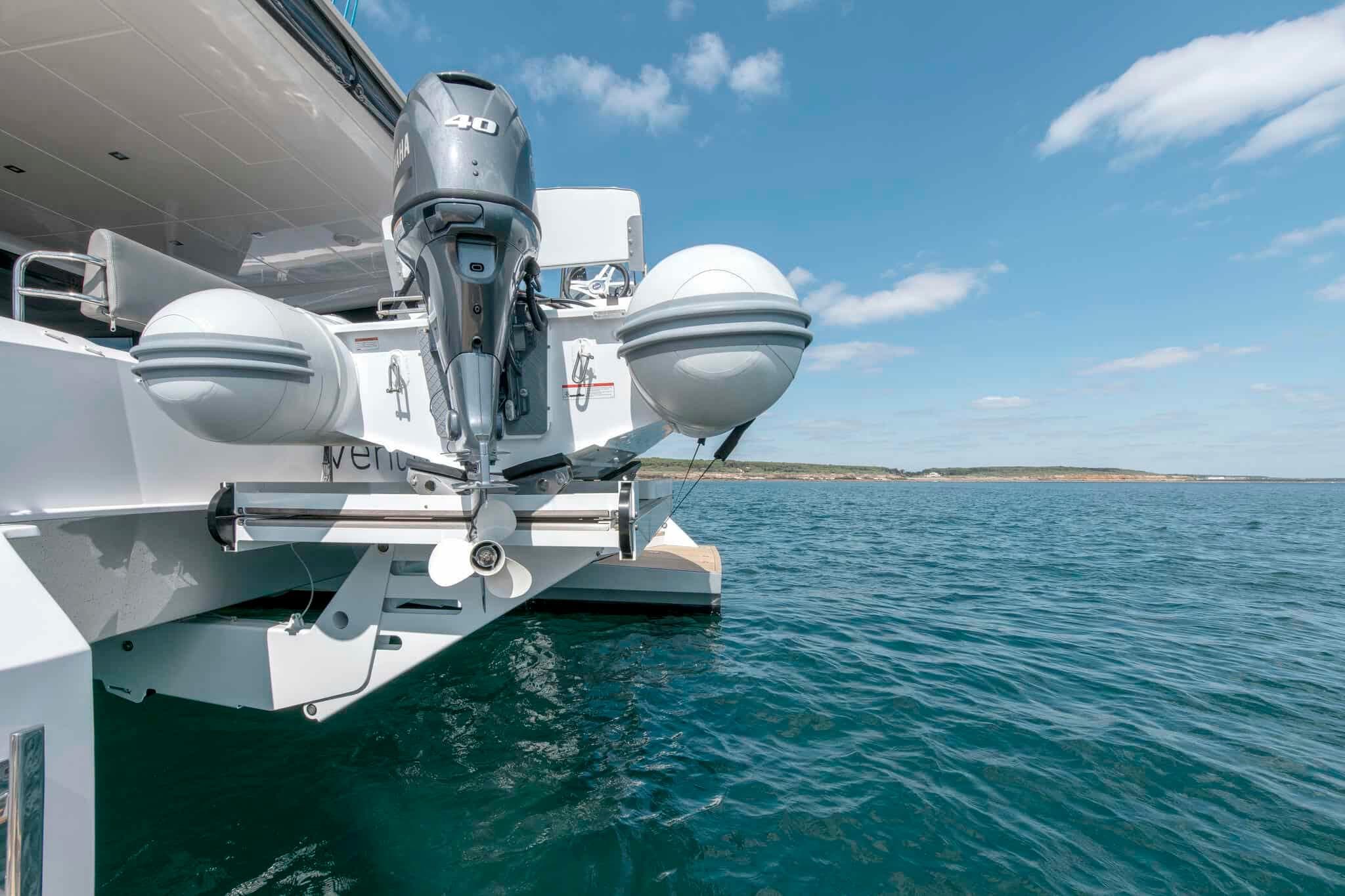 Luxury Privilege Signature 580 yacht with outboard motor, 2025 model, on clear blue water.