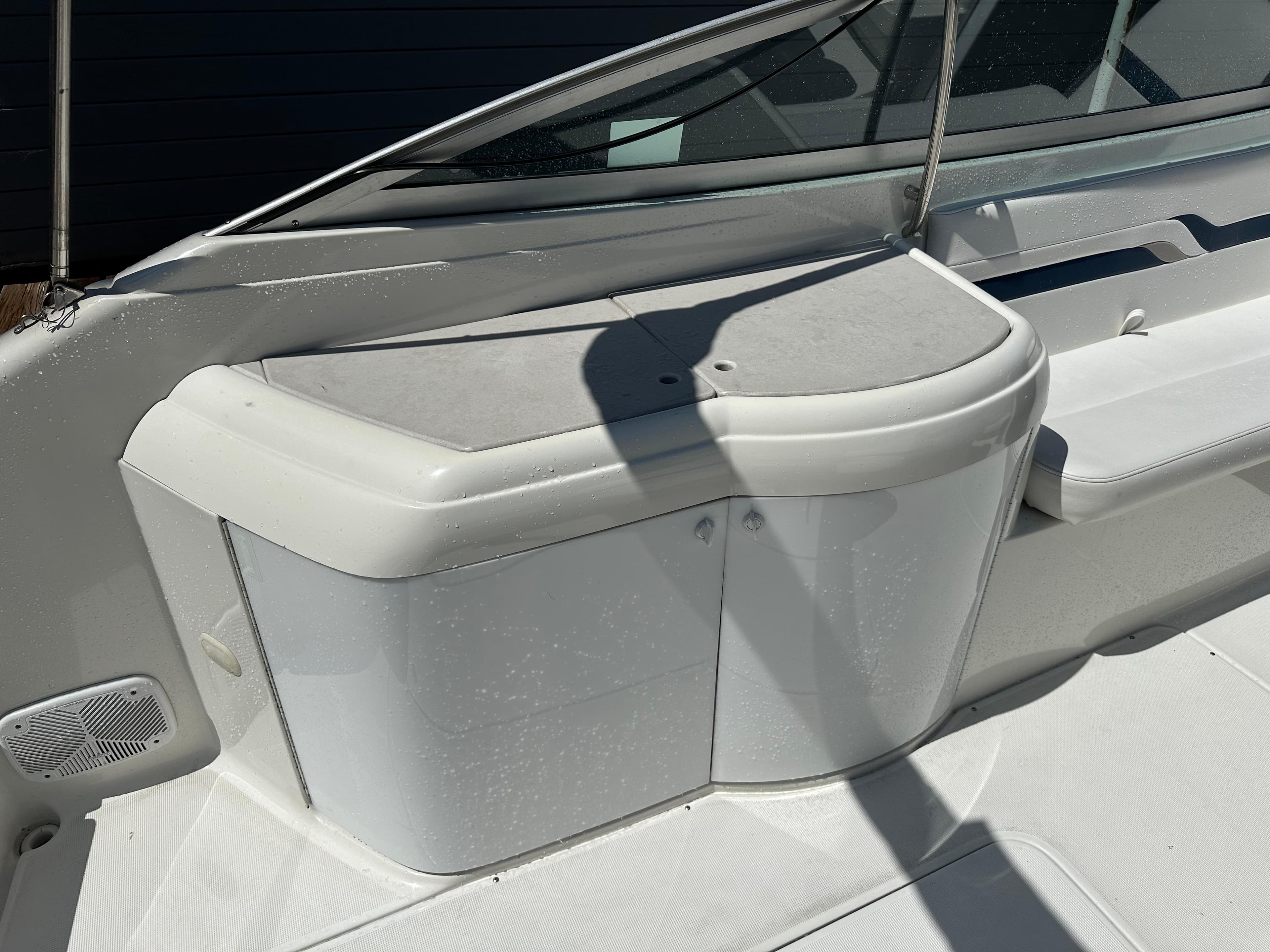 2000 Formula 330 SS boat interior detail with white cabinetry and seating.
