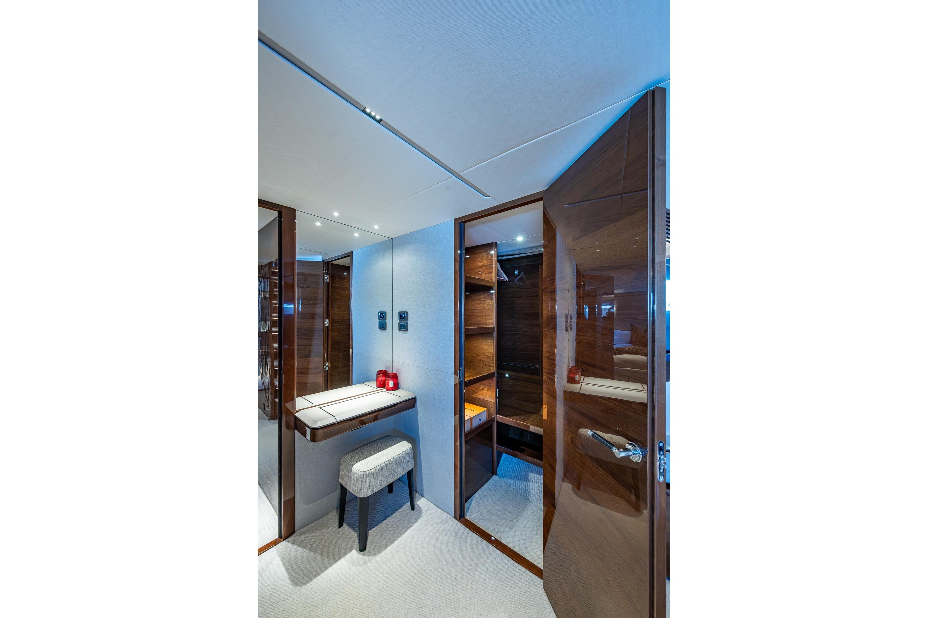 Luxurious interior of 2022 Princess X95 yacht with elegant wood finishes and modern design.