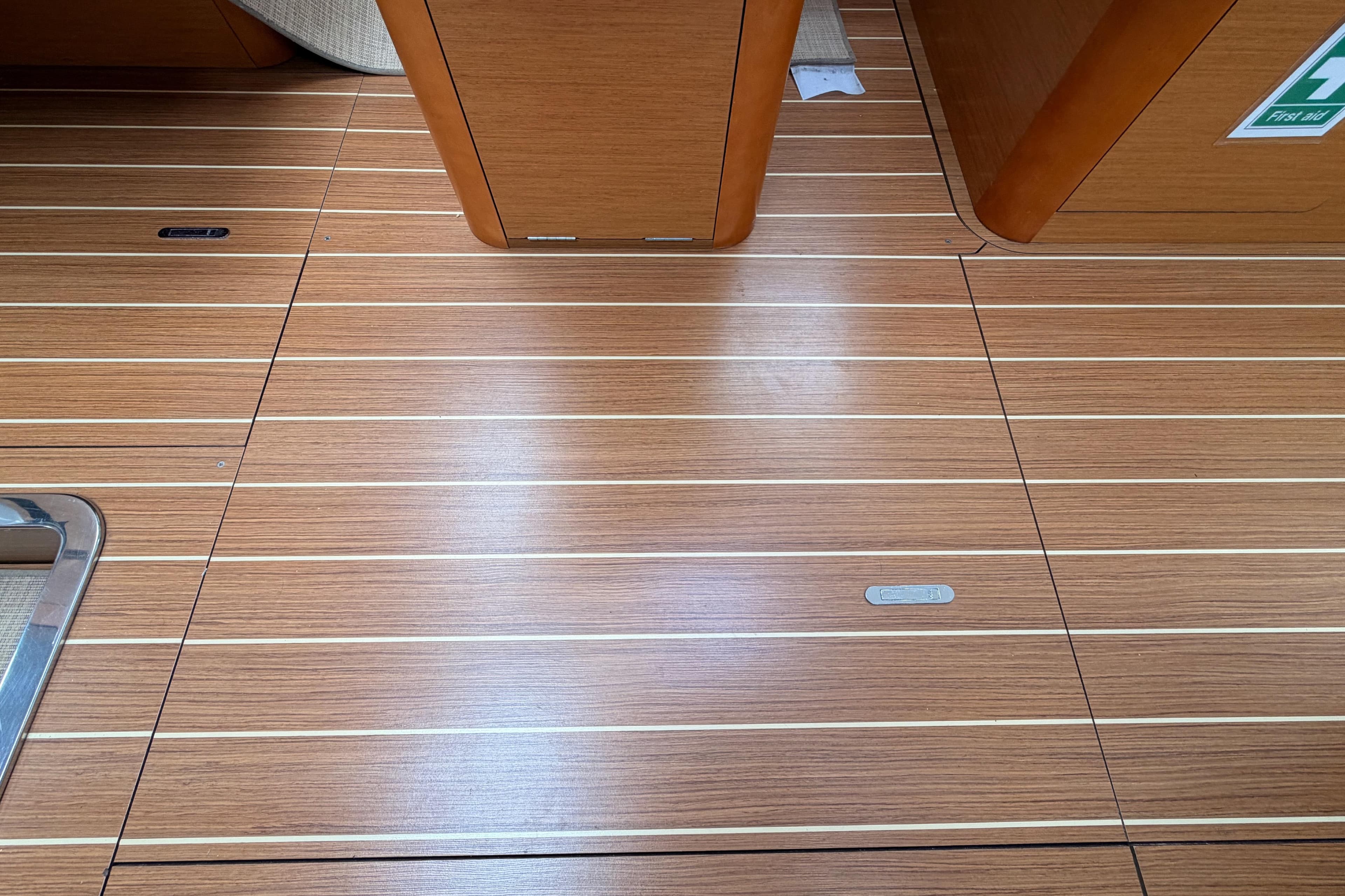 Teak flooring on 2014 Jeanneau Sun Odyssey 50 DS yacht interior.