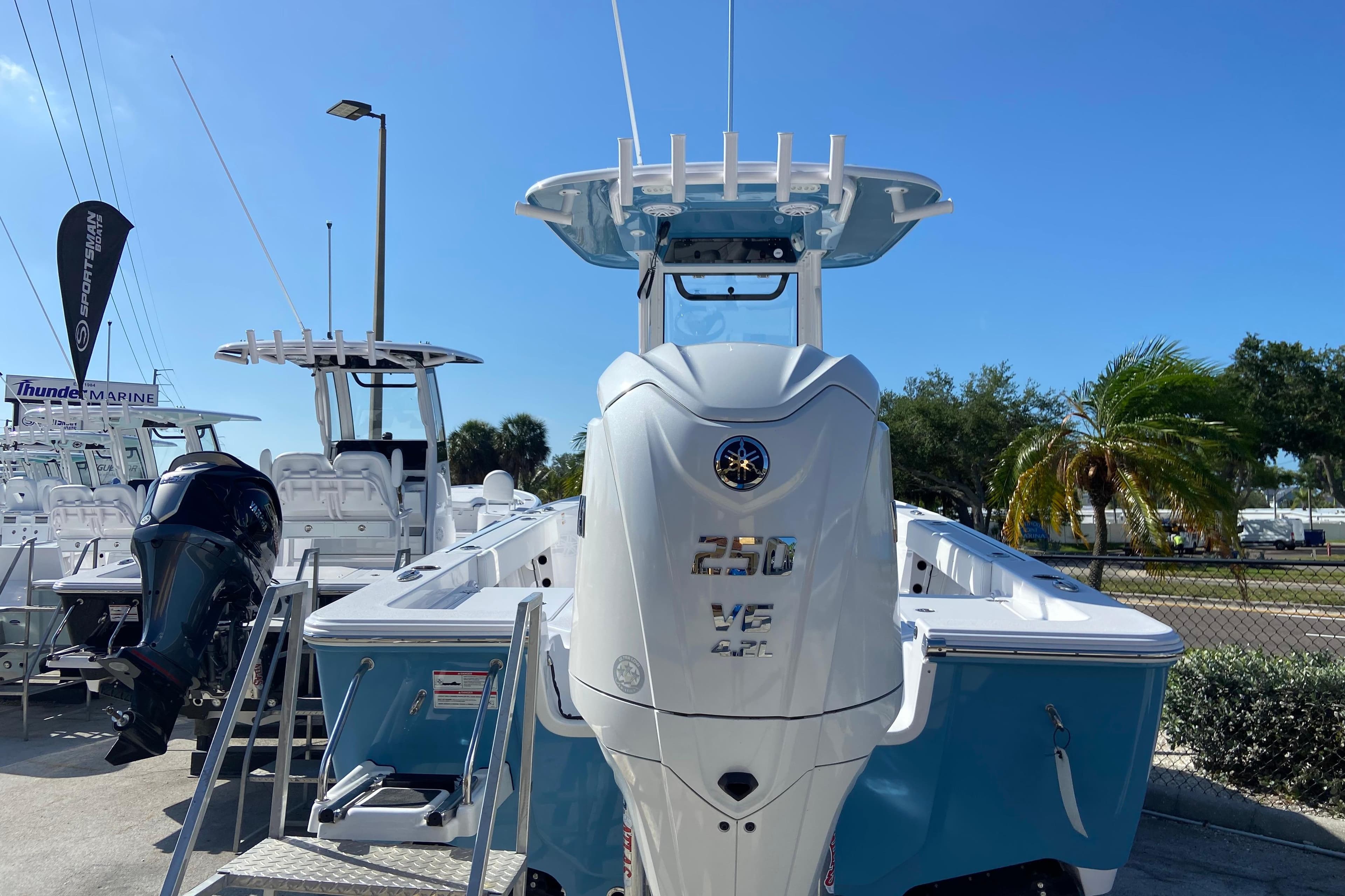 2026 Sportsman Masters 227 Bay Boat with powerful 250 V6 engine, displayed outdoors.