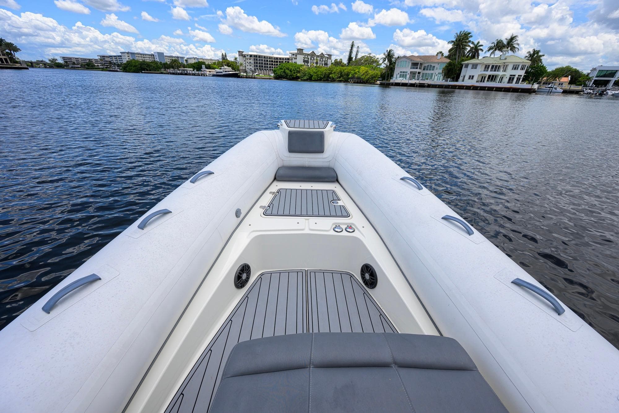 2021 Brig Eagle 8 boat on calm water, with modern seating and scenic waterfront view.