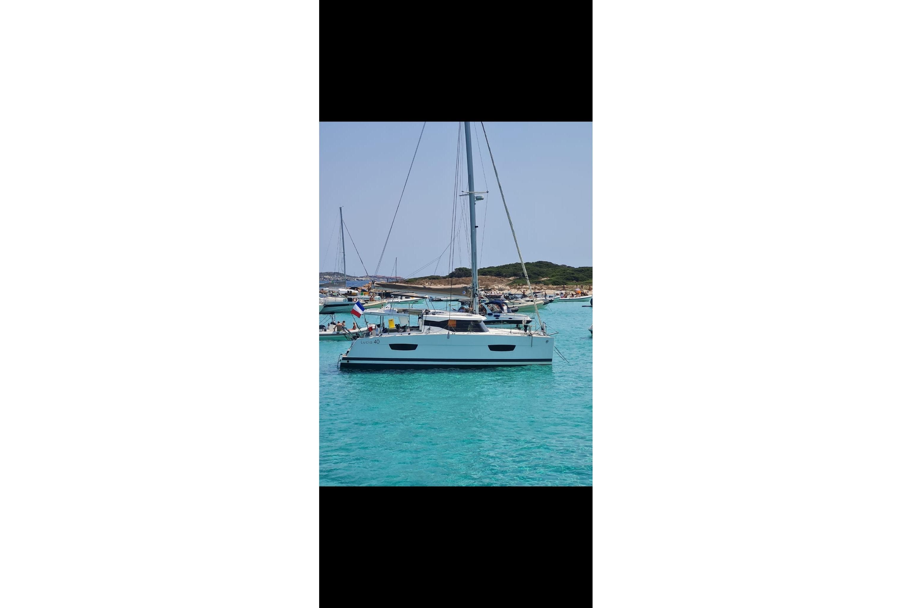 Fountaine Pajot Lucia 40 catamaran on turquoise water, year 2016.