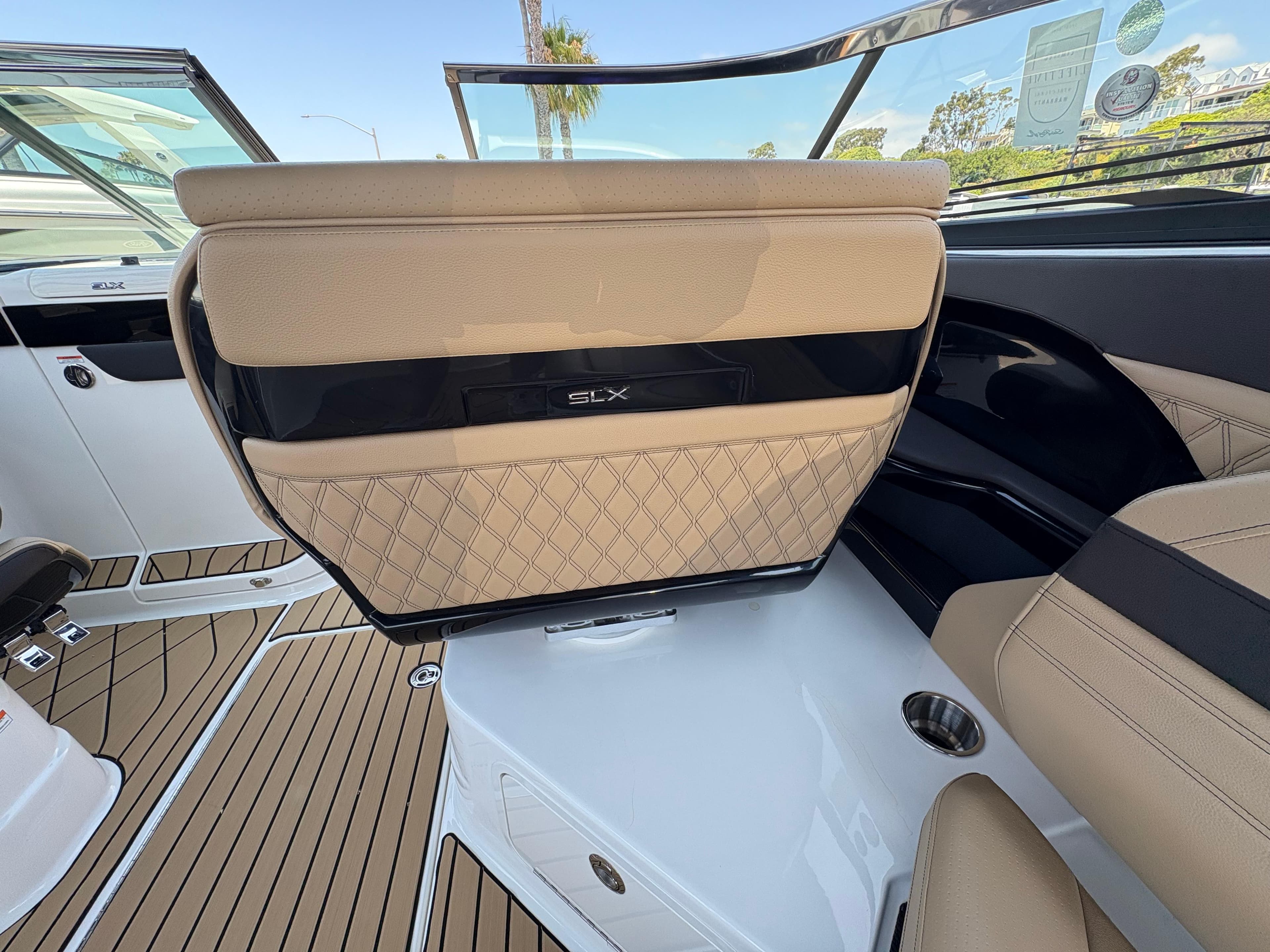 2026 Sea Ray SLX 280 boat interior with tan leather seating and sleek design.