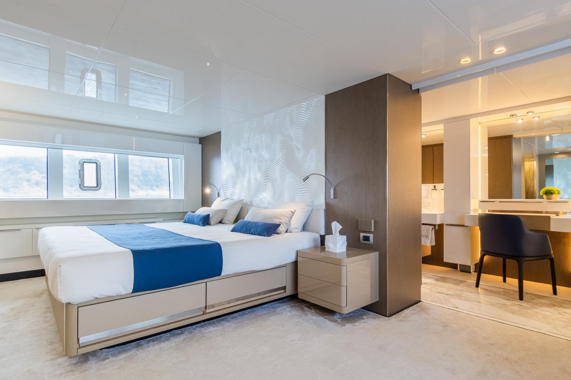 Luxurious bedroom interior of 2019 Arcadia Yachts A85 with modern design and elegant furnishings.